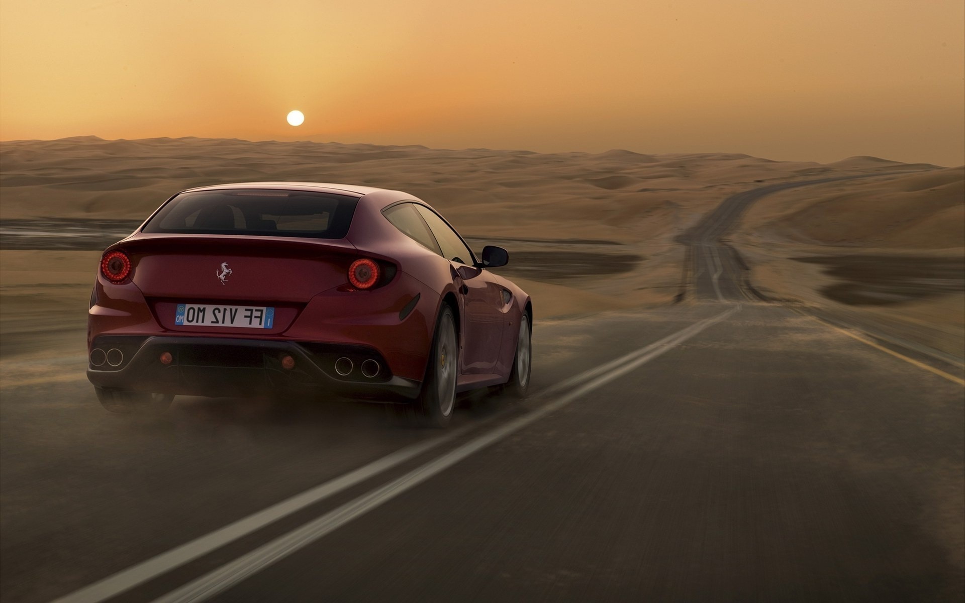 Handy-Wallpaper Sunset, Wüste, Landschaft, Auto, Roads, Transport, Ferrari kostenlos herunterladen.