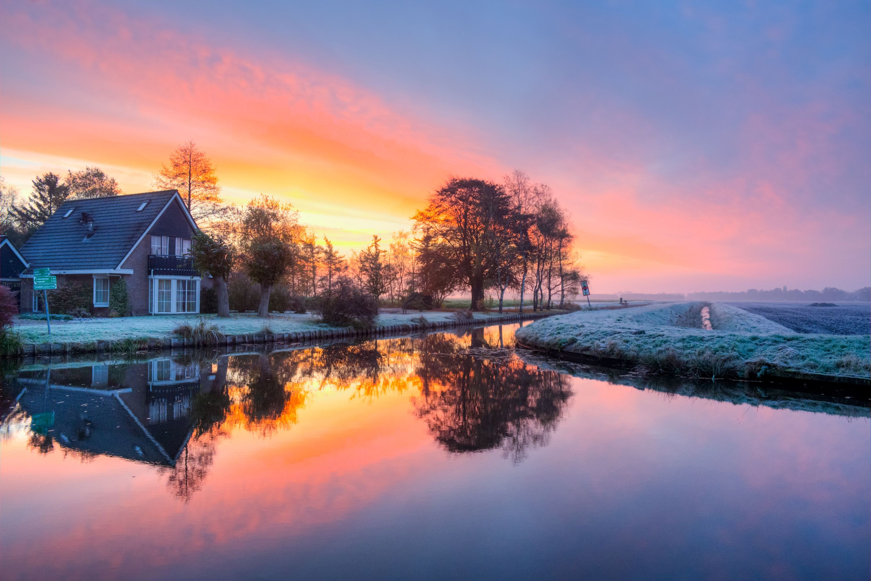 Download mobile wallpaper Winter, Sunset, Snow, Reflection, House, Man Made, Canal for free.
