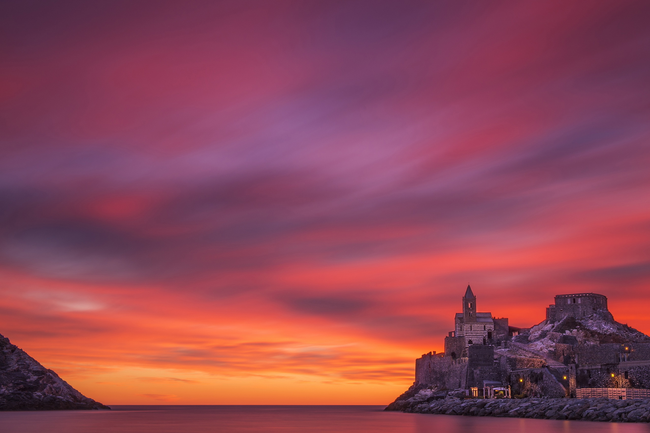 Download mobile wallpaper Sunset, Sky, Pink, Castles, Building, Horizon, Man Made, Castle, Orange (Color) for free.