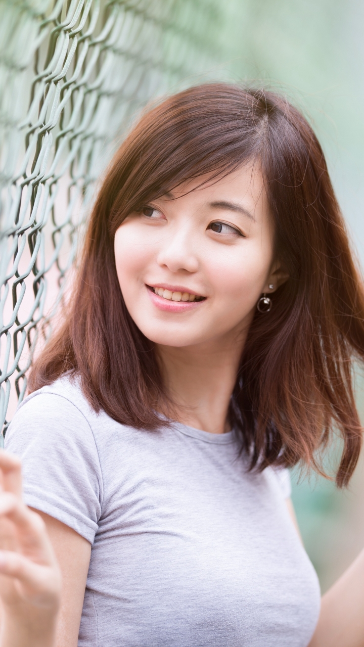 Download mobile wallpaper Blur, Fence, Smile, Brunette, Model, Women, Asian for free.