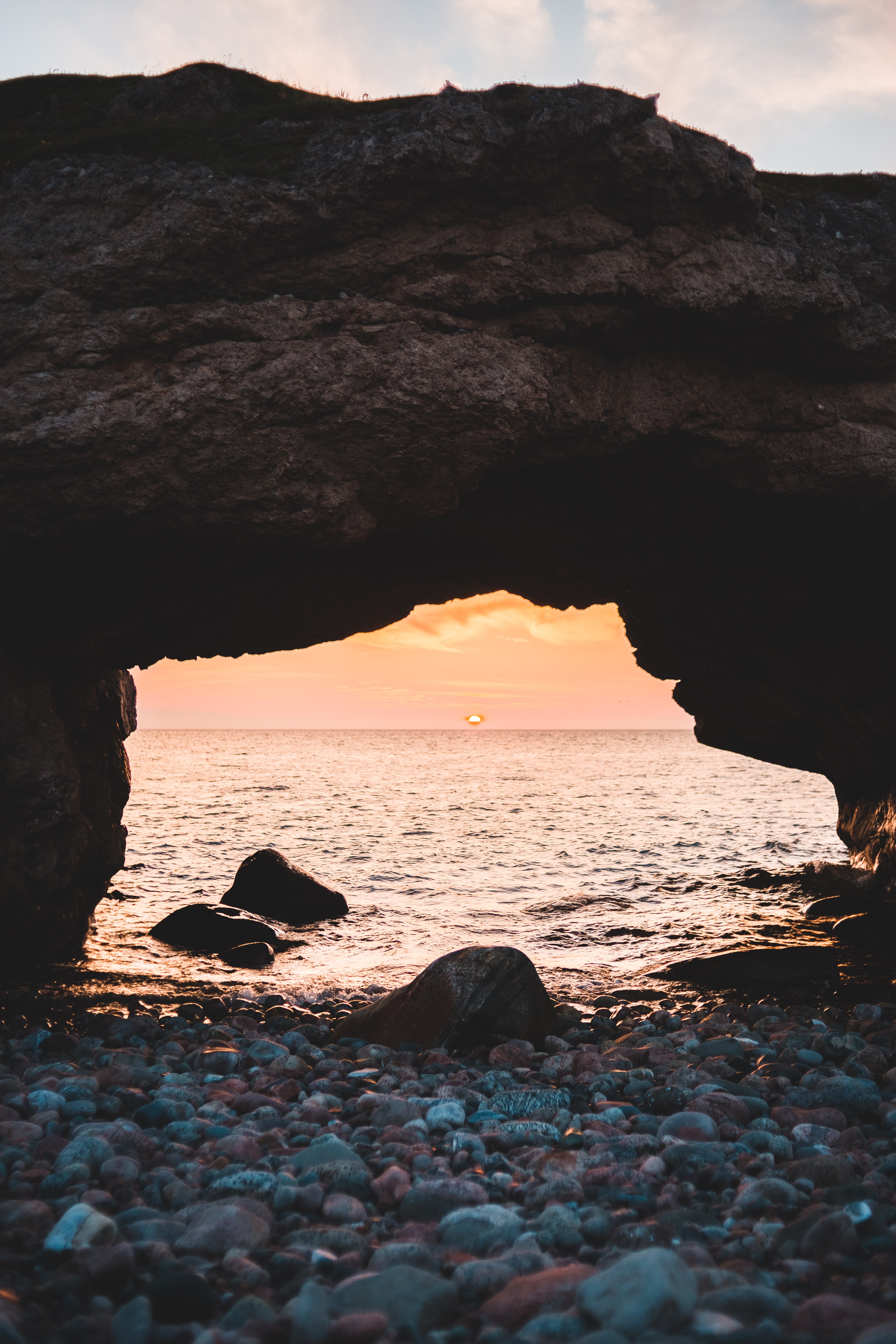 Download mobile wallpaper Arch, Coast, Stones, Sunset, Sea, Nature, Pebble for free.