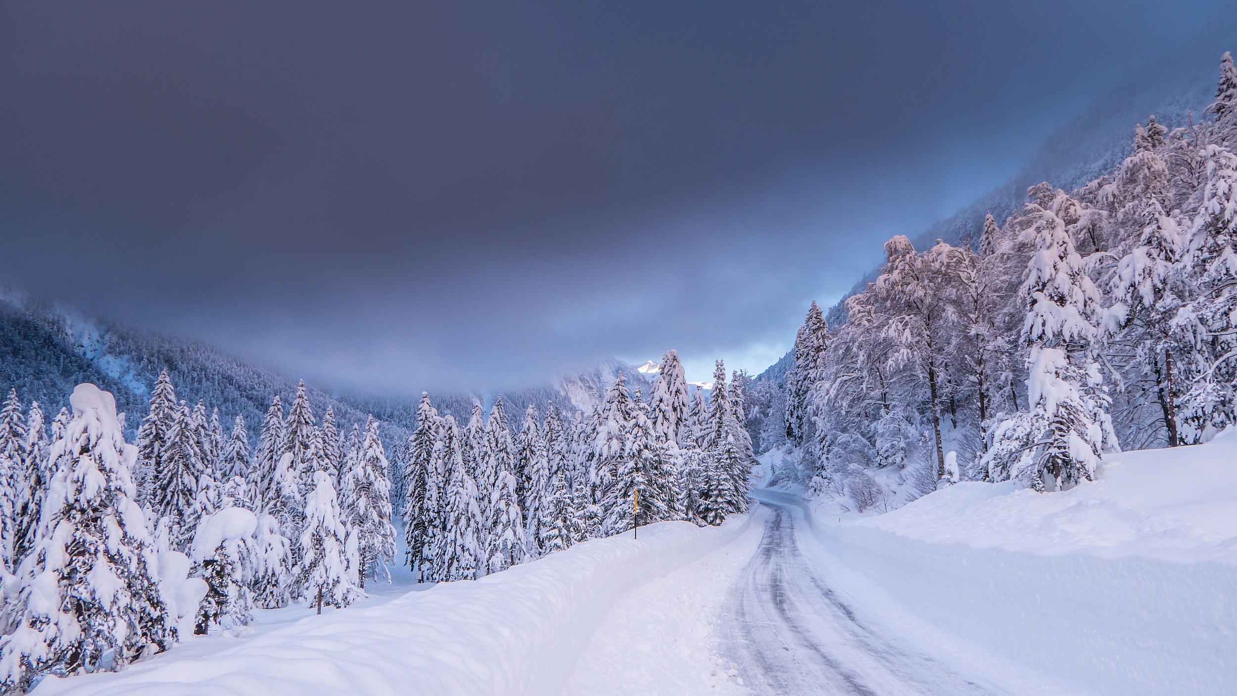 Free download wallpaper Winter, Nature, Snow, Italy, Road, Forest, Earth on your PC desktop