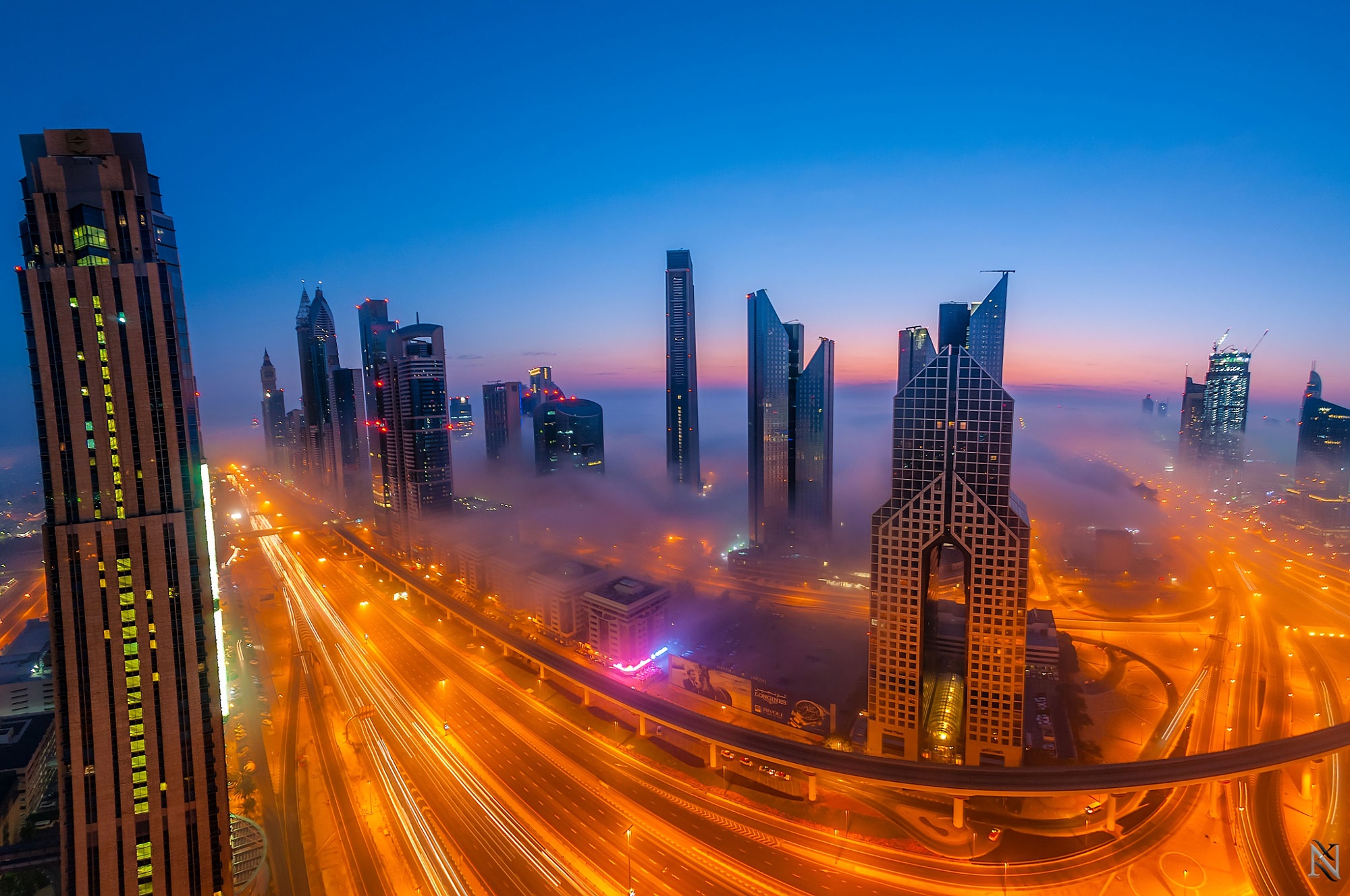 Handy-Wallpaper Städte, Nebel, Dubai, Nacht, Menschengemacht, Großstadt, Zeitraffer kostenlos herunterladen.