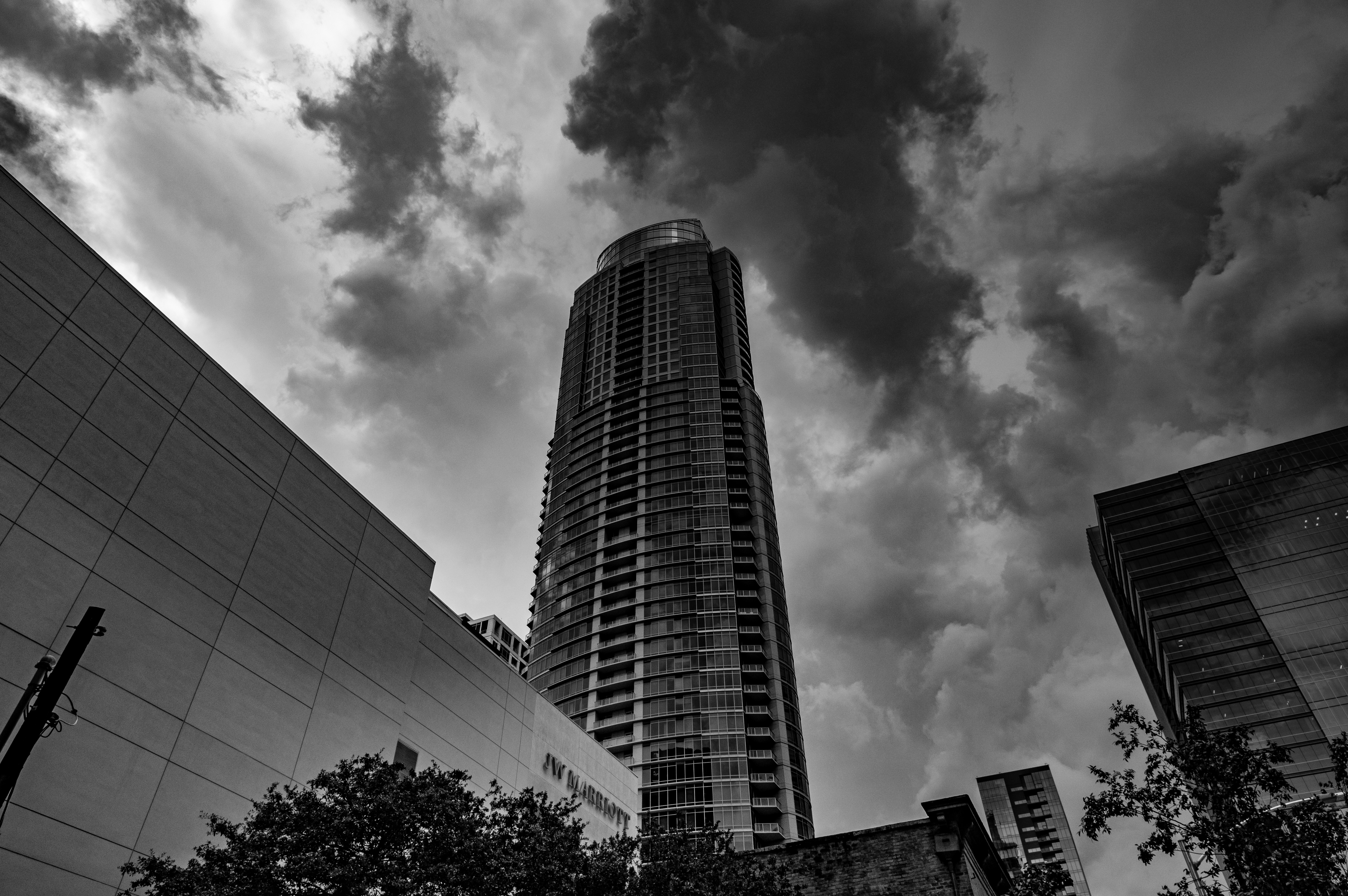 Download mobile wallpaper Cities, Clouds, Chb, Facade, Bw, Skyscraper for free.