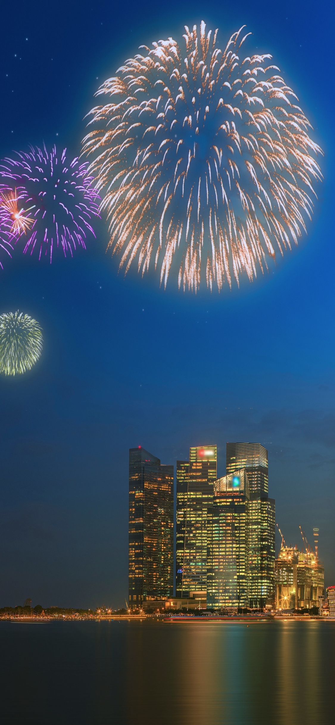 Download mobile wallpaper Night, Skyscraper, Building, Light, Singapore, Fireworks, Photography for free.