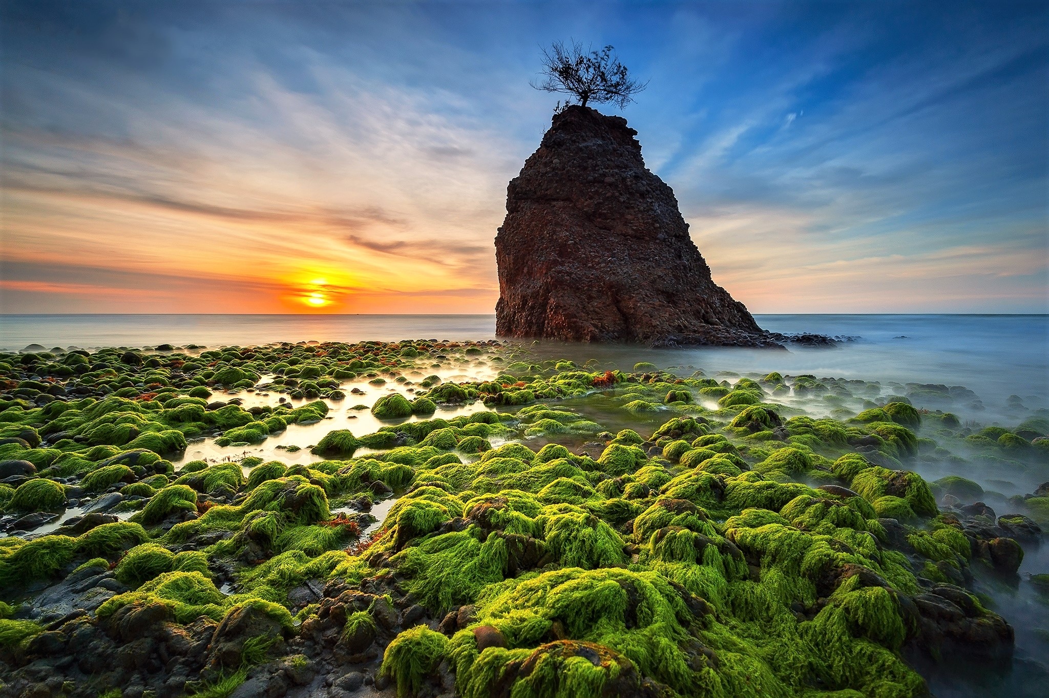 Download mobile wallpaper Sunset, Sky, Sea, Rock, Horizon, Ocean, Earth, Stone, Moss for free.