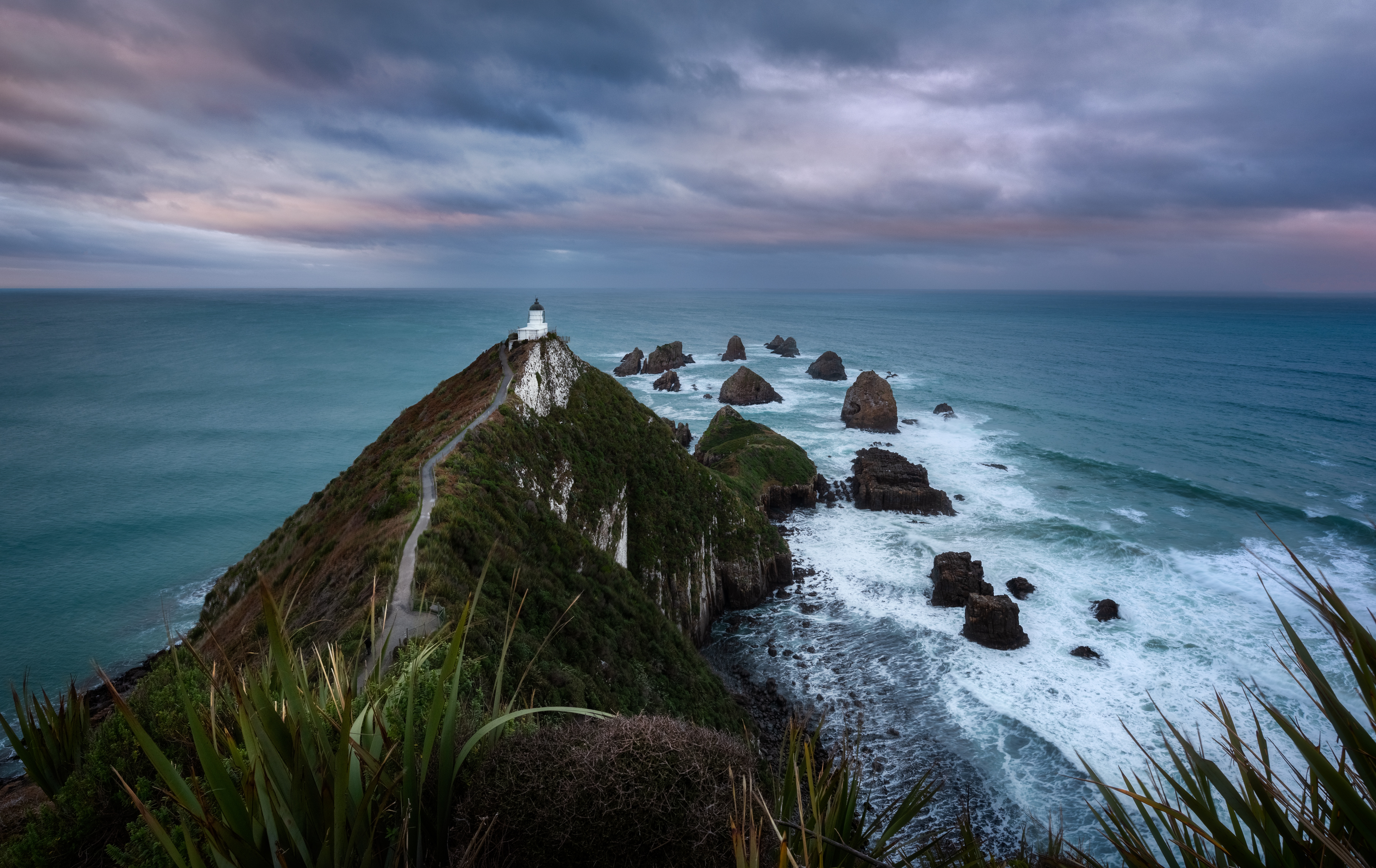 Скачать картинку Природа, Горизонт, Новая Зеландия, Океан, Маяк, Сделано Человеком в телефон бесплатно.