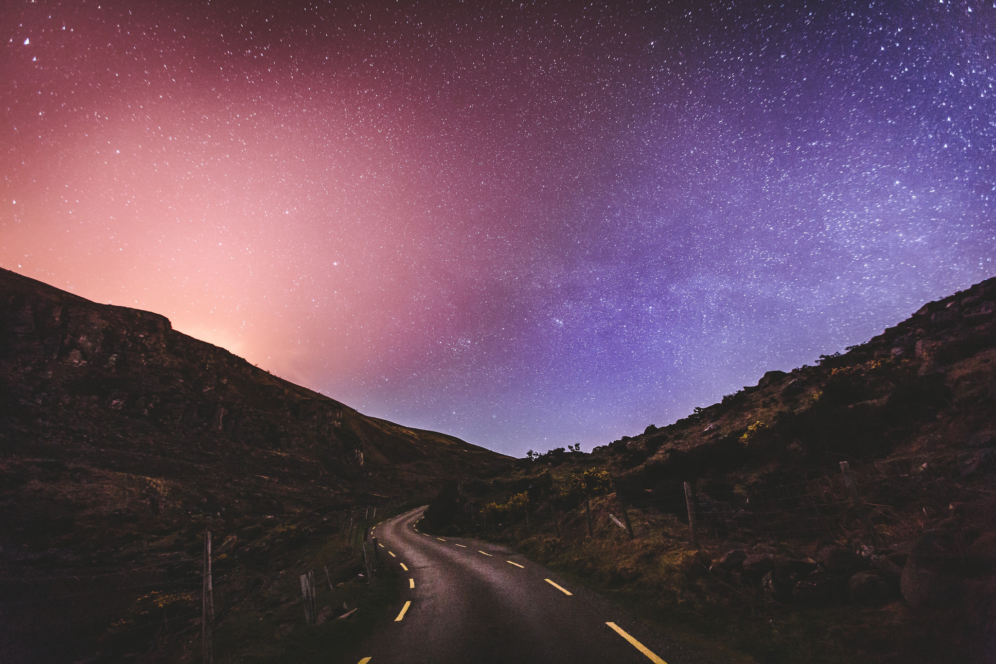 Free download wallpaper Sky, Stars, Pink, Night, Road, Purple, Hill, Man Made on your PC desktop