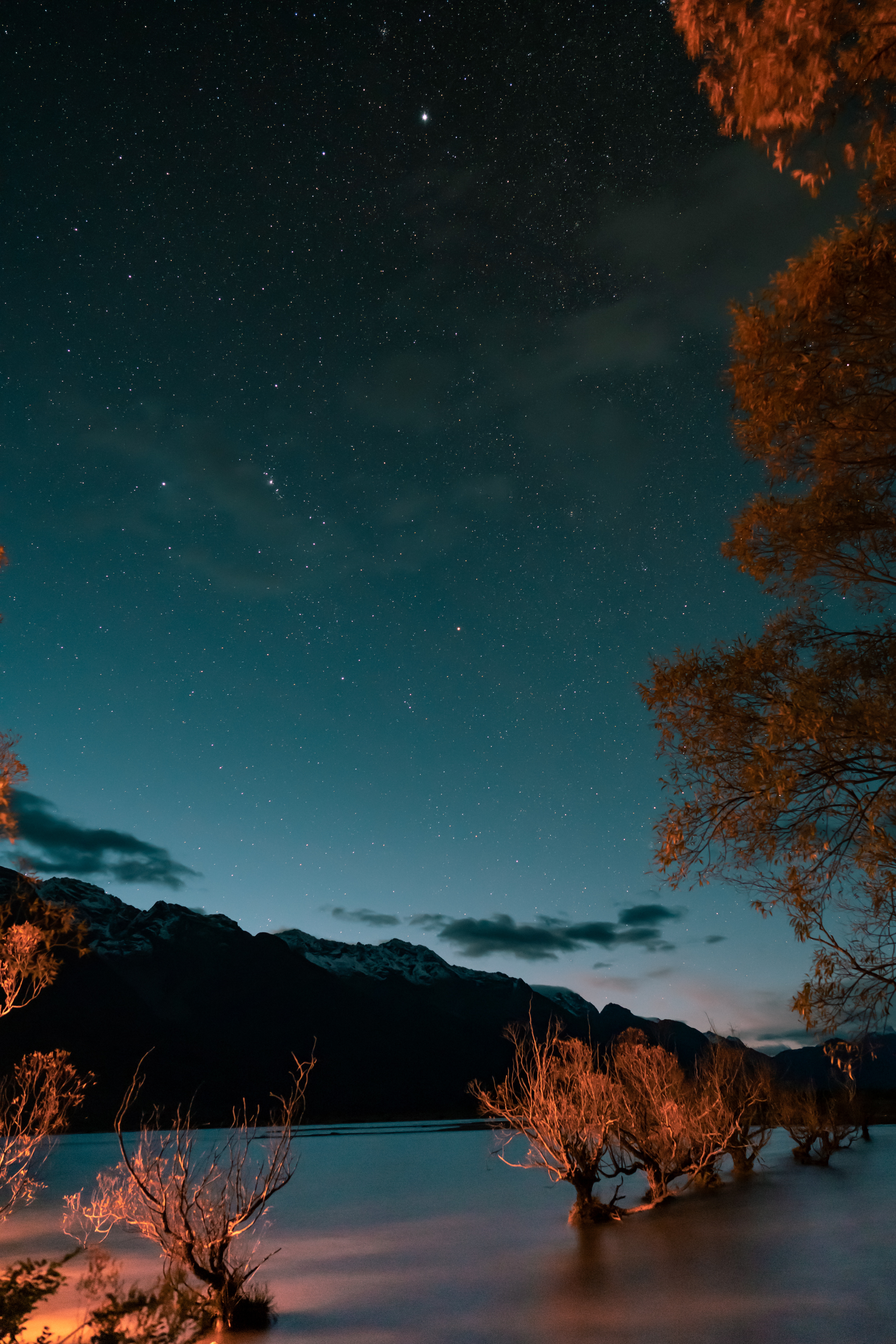 Download mobile wallpaper Trees, Twilight, Dusk, Mountains, Lake, Nature, Starry Sky for free.