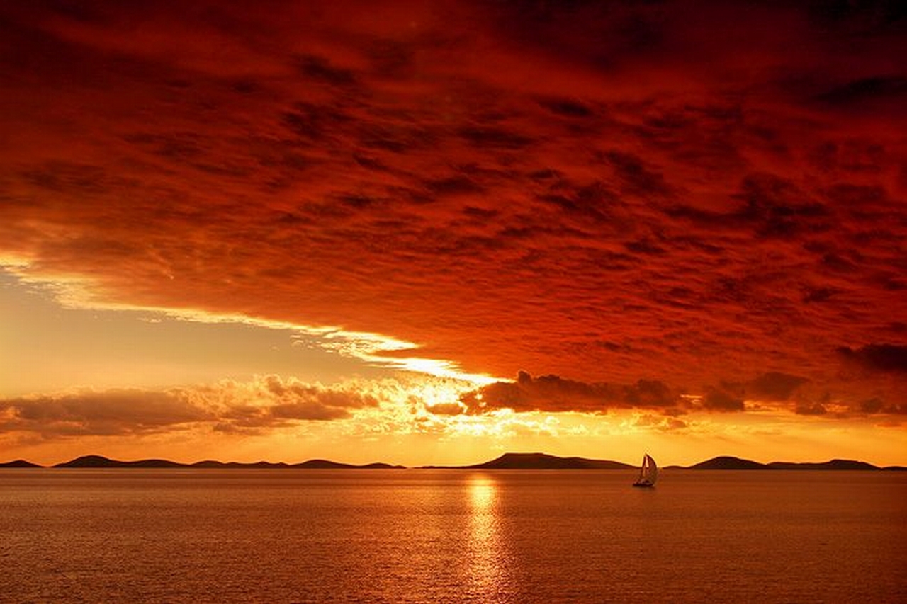 Free download wallpaper Sunset, Ocean, Earth, Boat, Cloud, Orange (Color) on your PC desktop