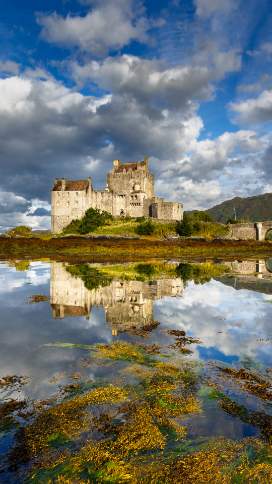 Download mobile wallpaper Sky, Castles, Lake, Reflection, Bridge, Scotland, Cloud, Man Made, Castle, Eilean Donan Castle for free.