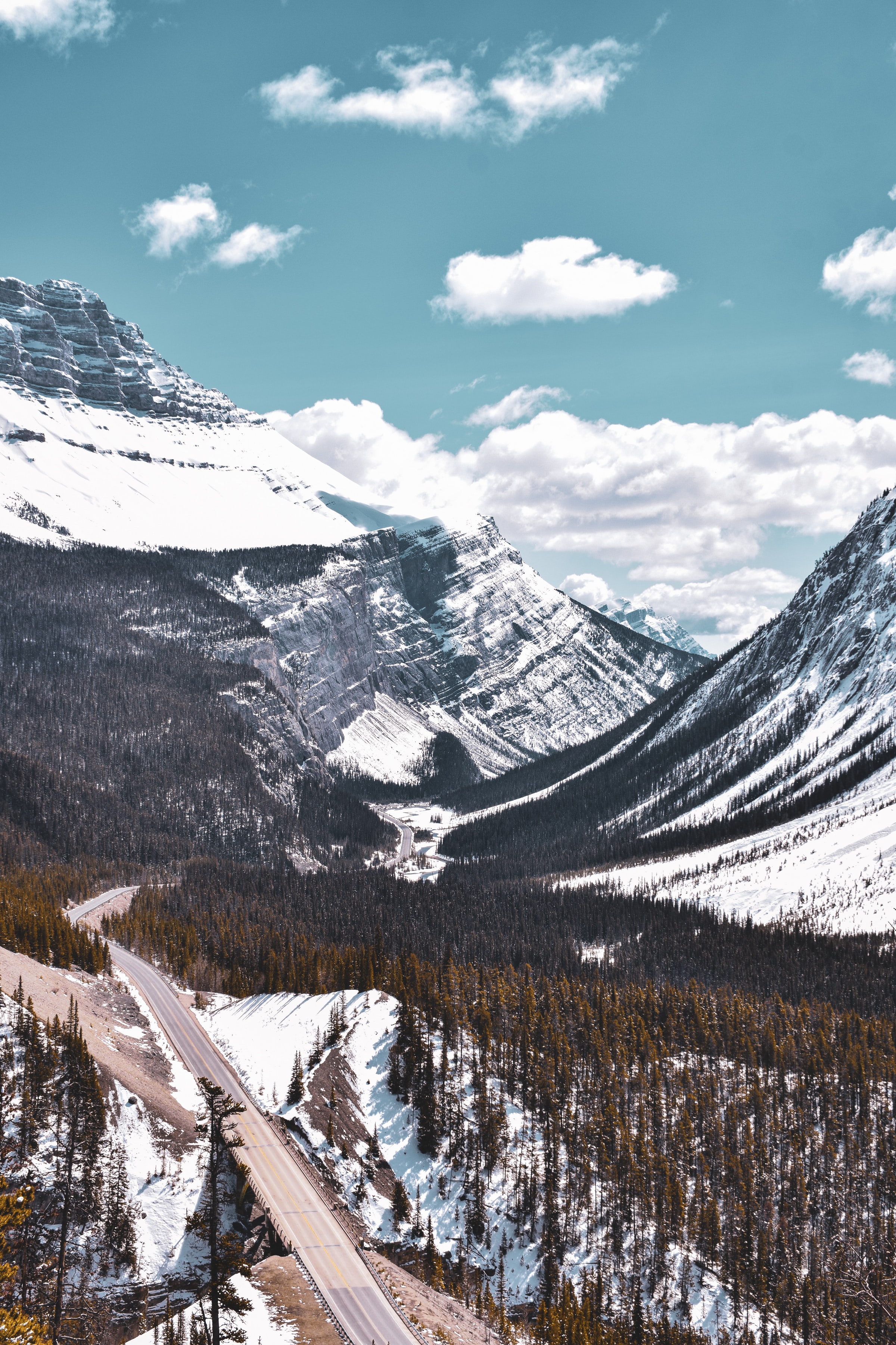 Download mobile wallpaper Snow, Road, Rocks, Trees, Mountains, Nature for free.