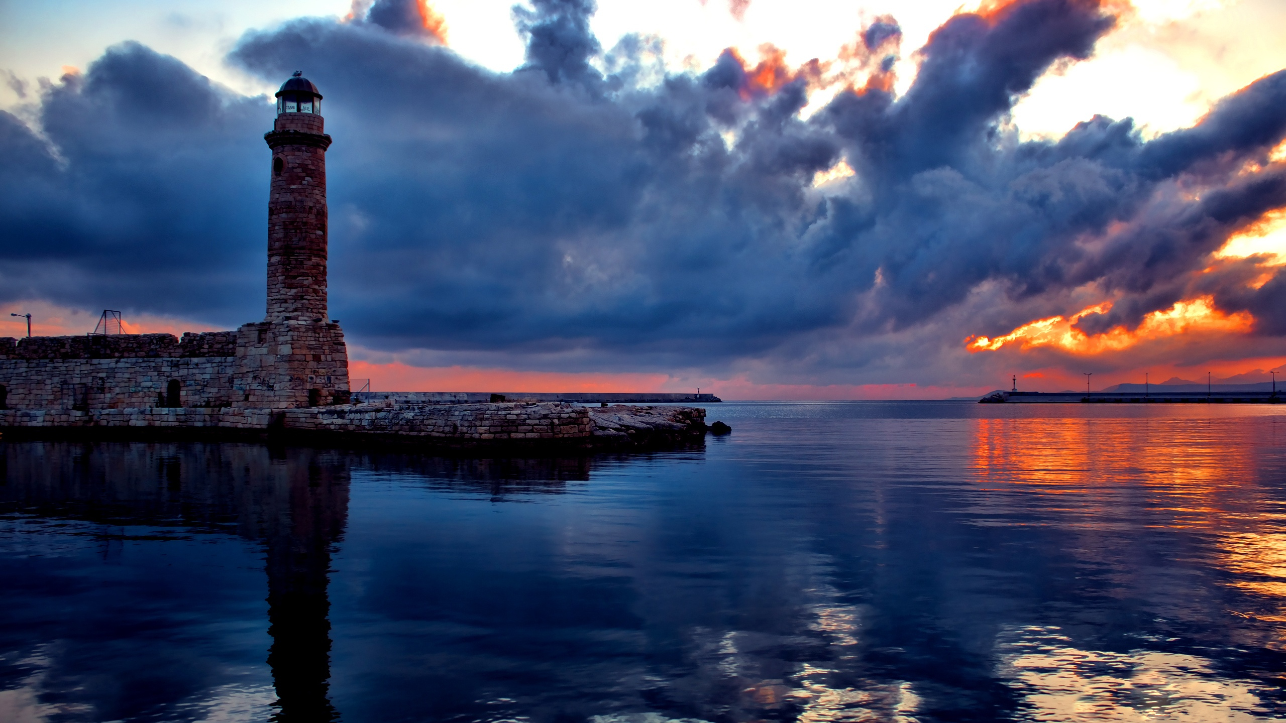 Free download wallpaper Sunset, Sky, Sea, Ocean, Lighthouse, Cloud, Man Made on your PC desktop