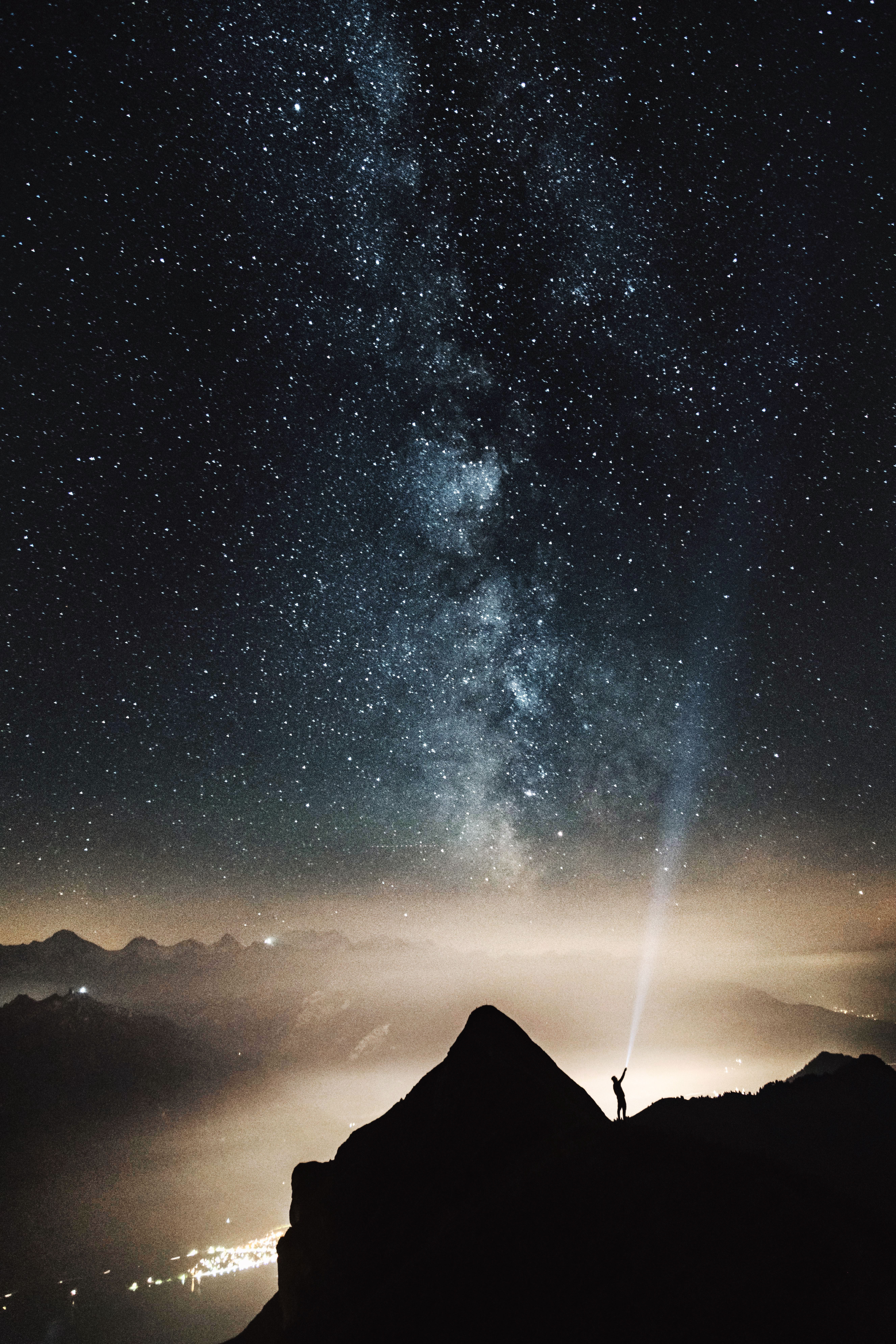 Download mobile wallpaper Mountains, Illumination, Silhouette, Lighting, Nature, Starry Sky for free.
