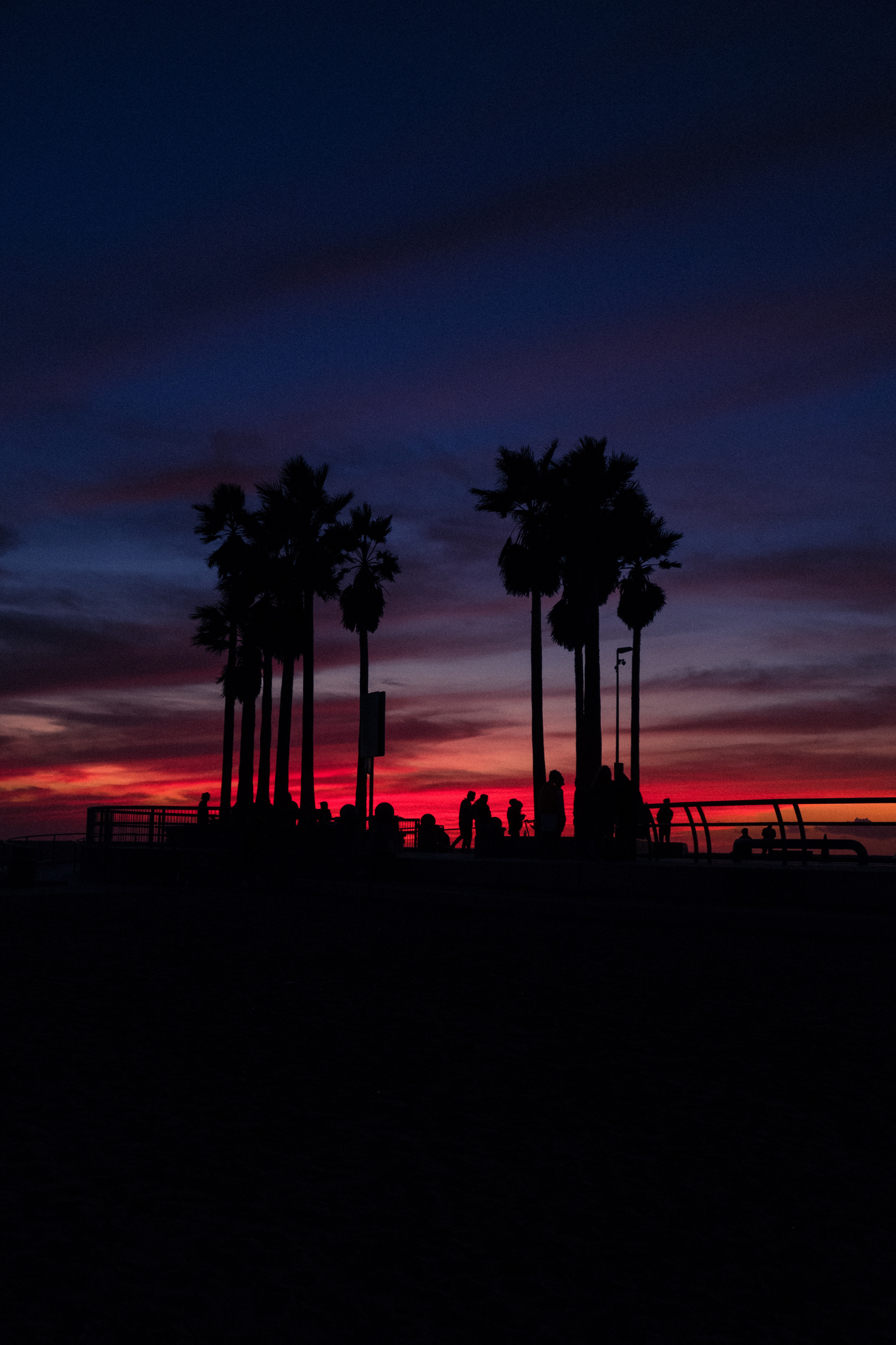 Free download wallpaper Sunset, Sky, Tropics, Dark, Palms, Silhouettes, People on your PC desktop