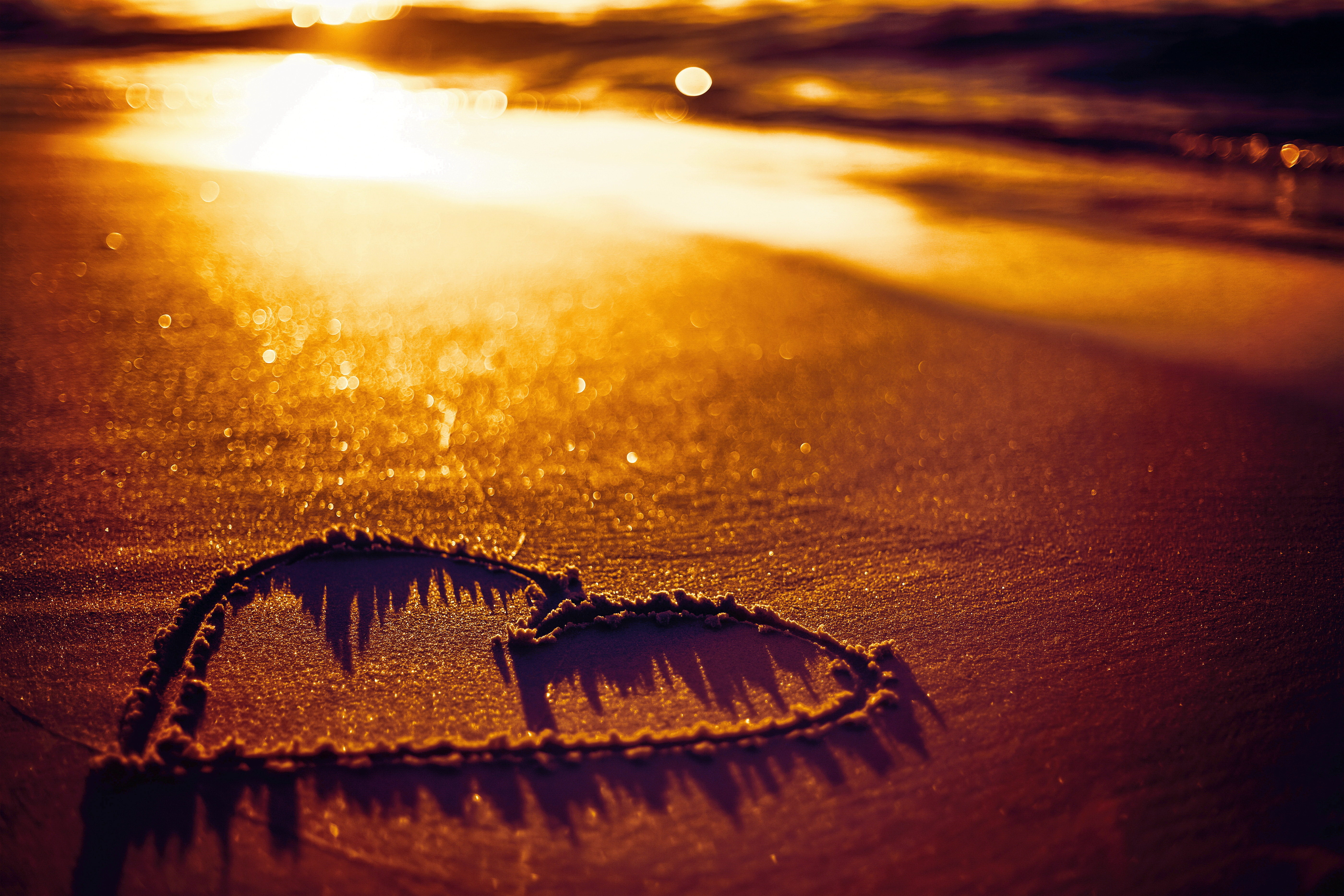 Download mobile wallpaper Sunset, Sand, Love, Heart, Photography, Romantic for free.