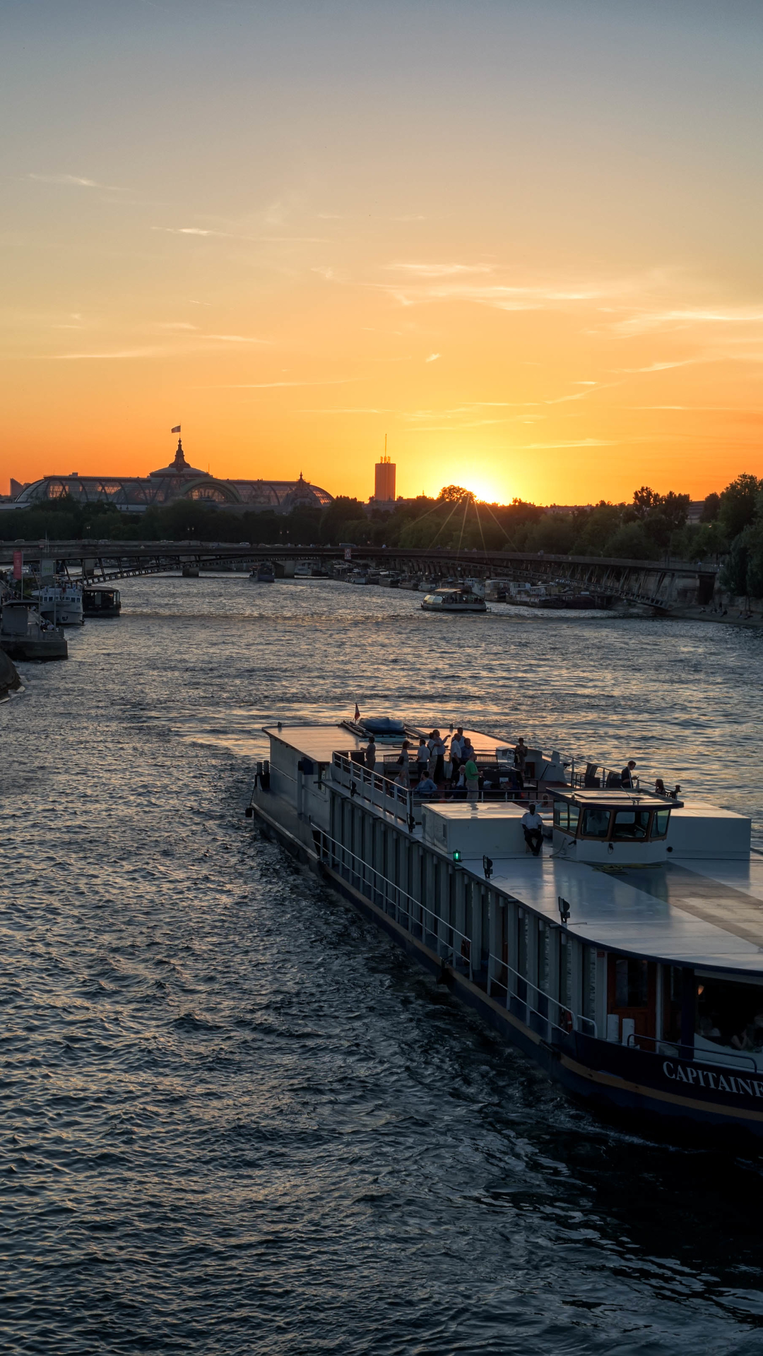 Download mobile wallpaper Cities, Sunset, Paris, France, Evening, Boat, Ship, River, Man Made, Passenger Ship, Seine for free.