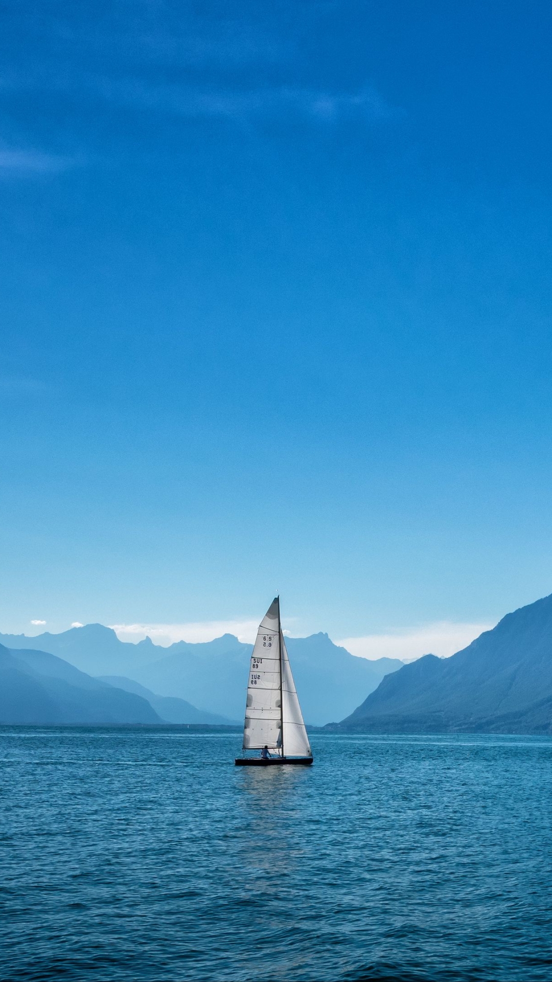 Download mobile wallpaper Sky, Sea, Mountain, Ocean, Sailboat, Vehicles for free.