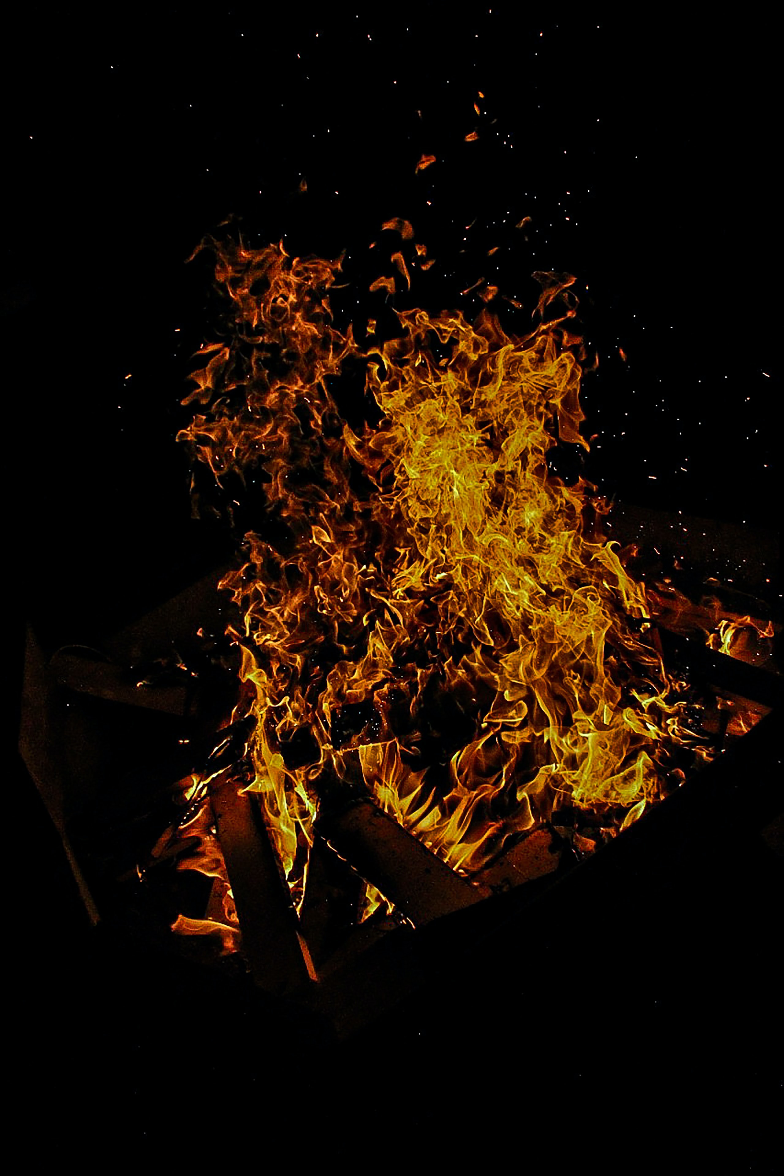 Download mobile wallpaper Sparks, Flame, Bonfire, Dark for free.