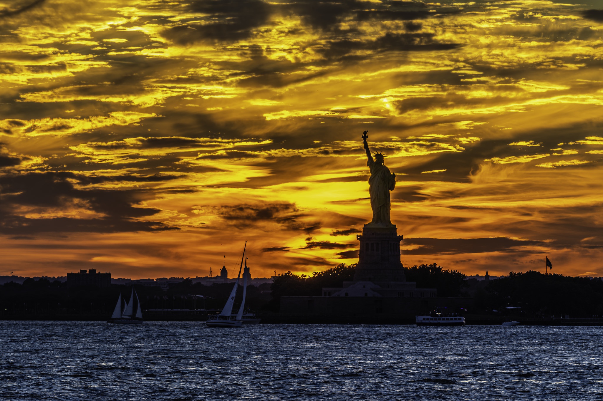 Free download wallpaper Sunset, Sky, Statue Of Liberty, Man Made on your PC desktop