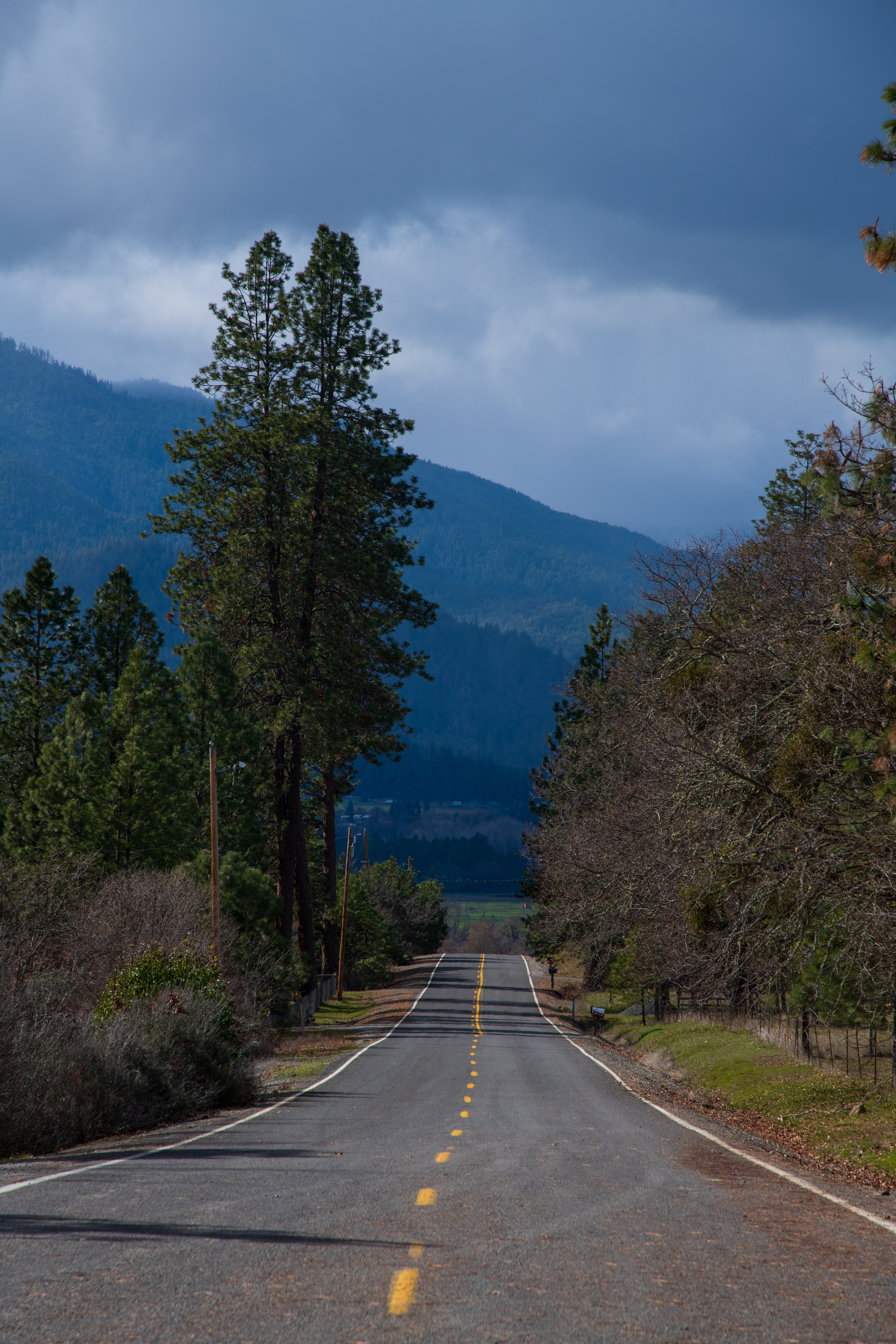 Download mobile wallpaper Trees, Mountains, Road, Landscape, Nature for free.