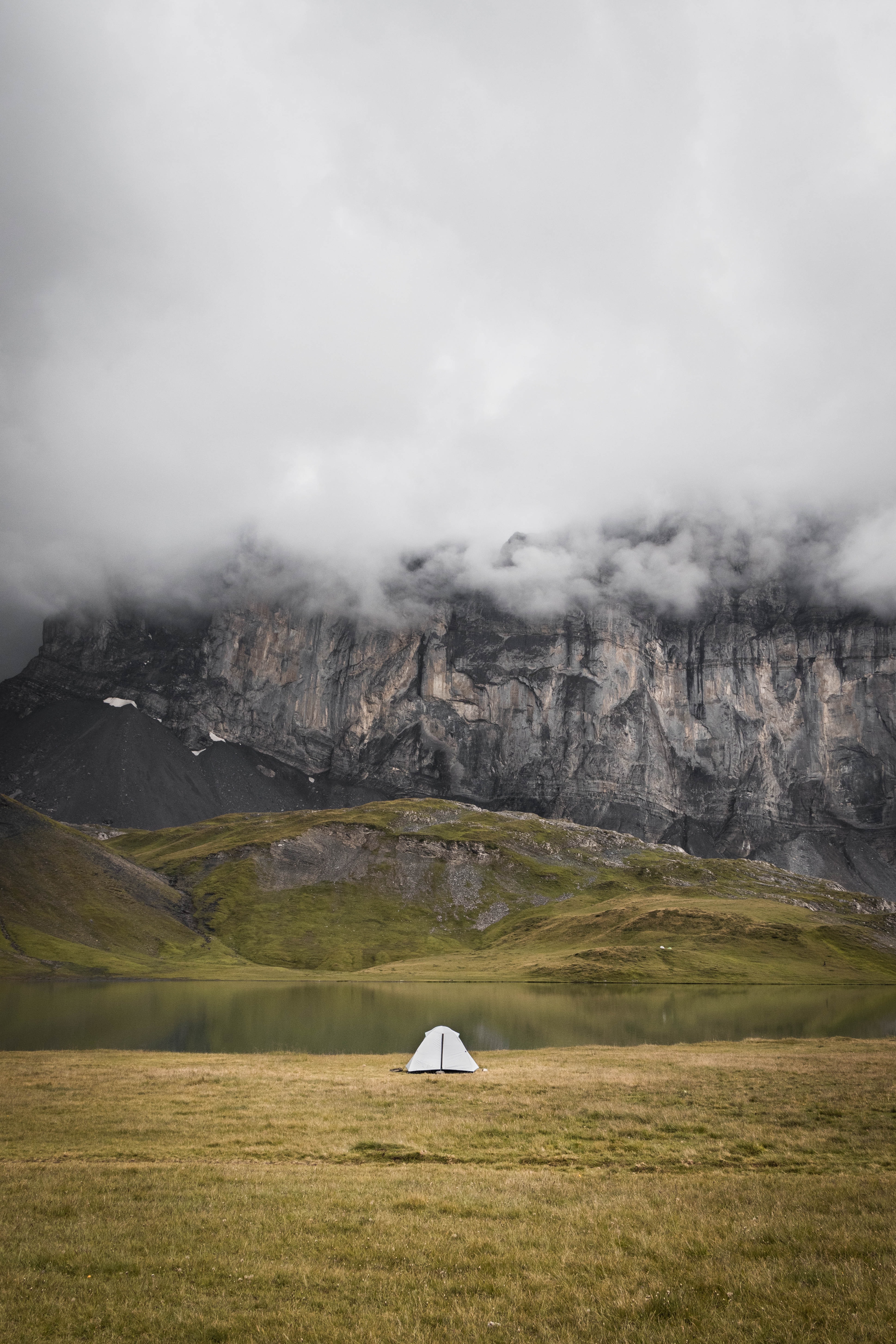 Download mobile wallpaper Fog, Grass, Rocks, Mountains, Nature, Tent for free.