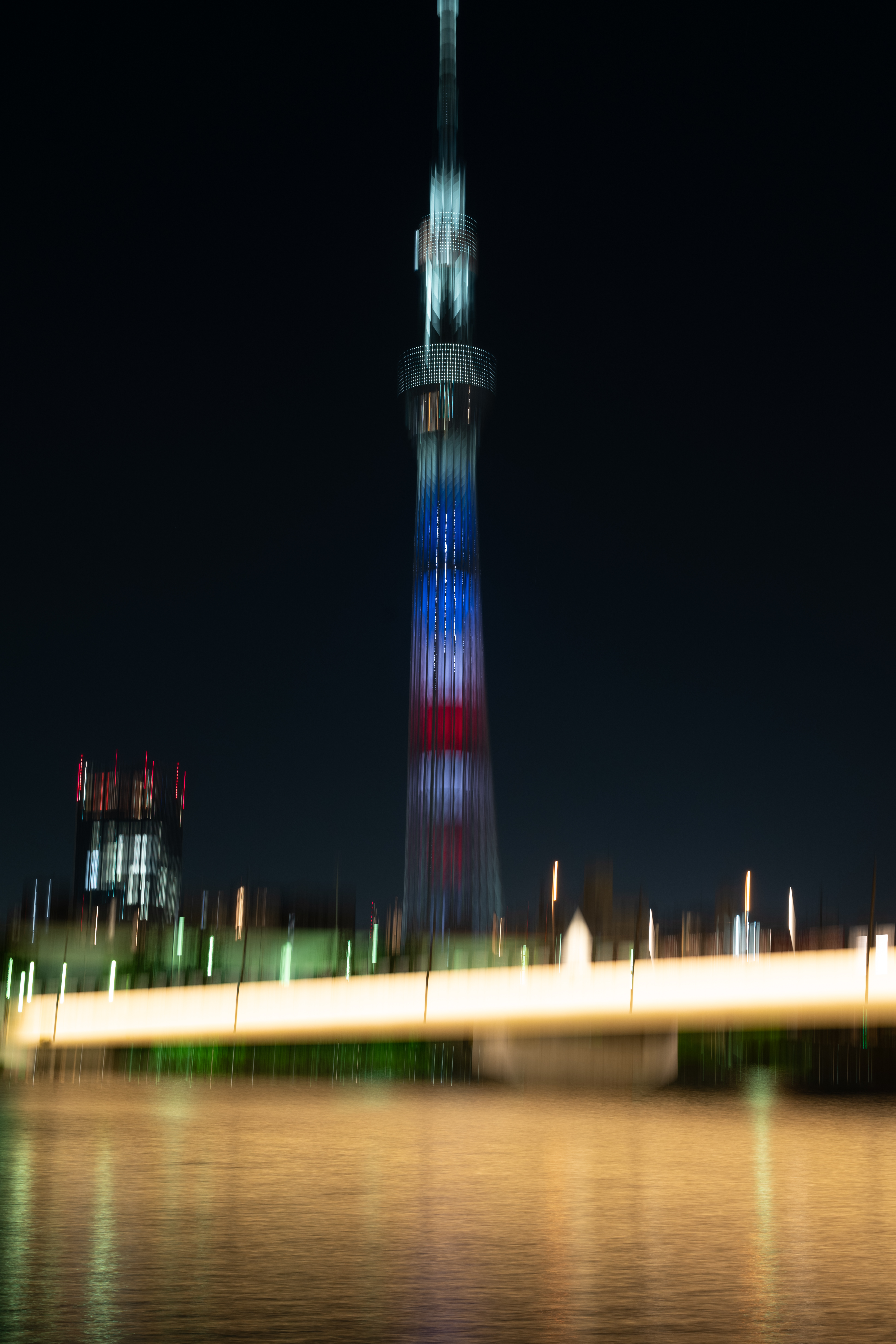 Download mobile wallpaper Cities, City, Tower, Building, Backlight, Illumination, Architecture, Smooth, Blur for free.
