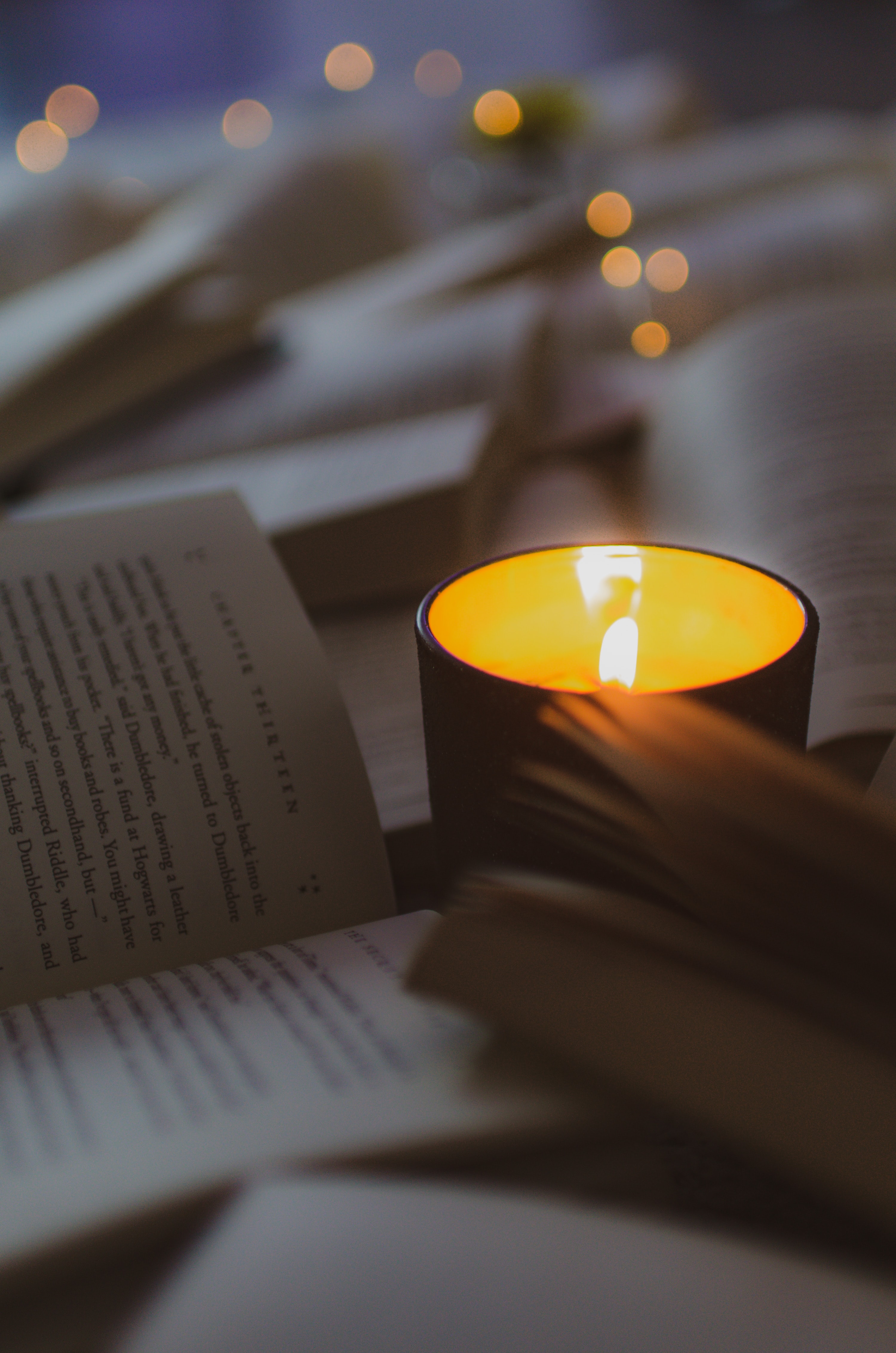 Download mobile wallpaper Miscellanea, Miscellaneous, Coziness, Glow, Comfort, Book, Candle for free.