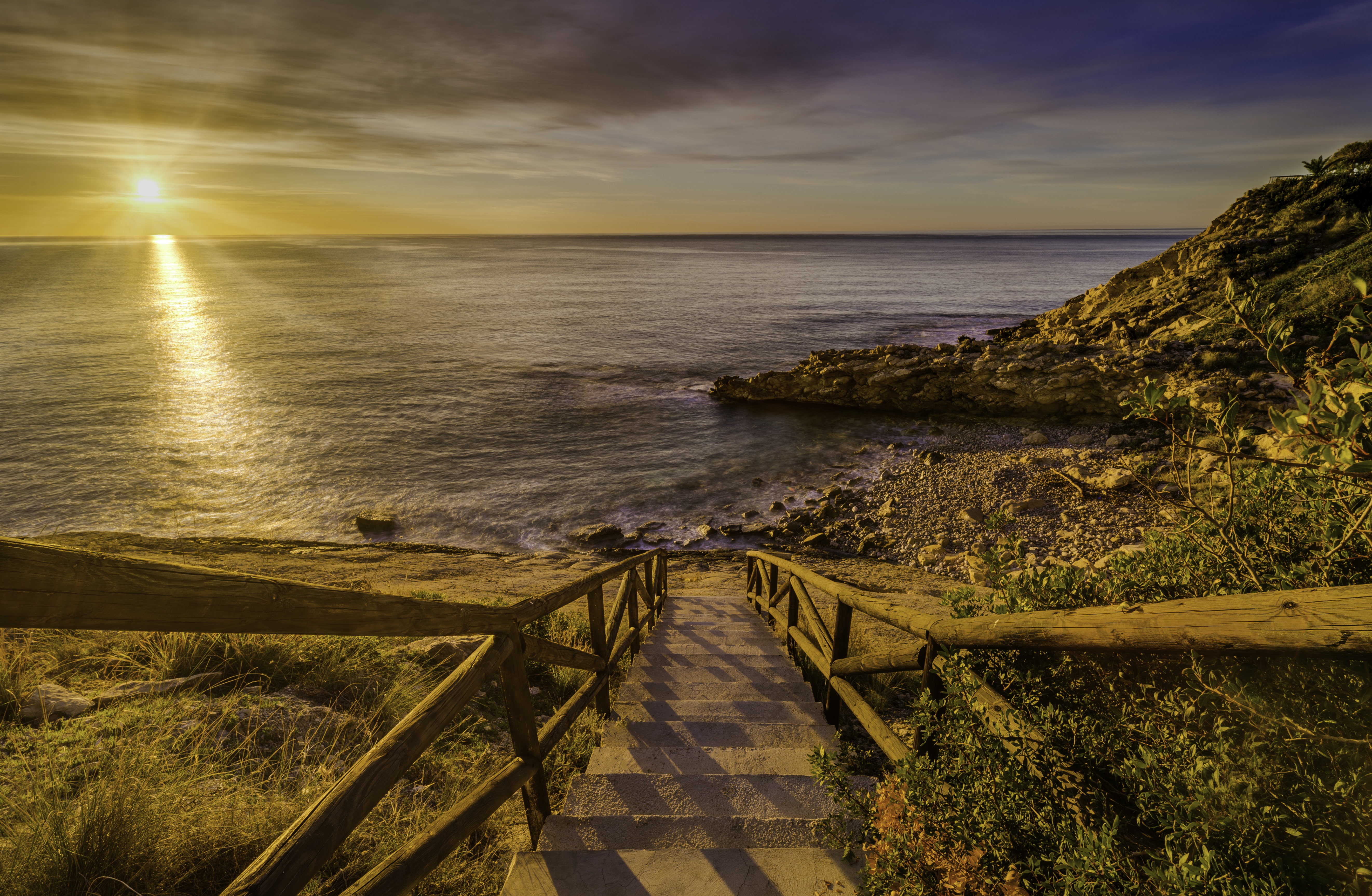 Download mobile wallpaper Horizon, Coast, Ocean, Sunrise, Stairs, Spain, Photography for free.