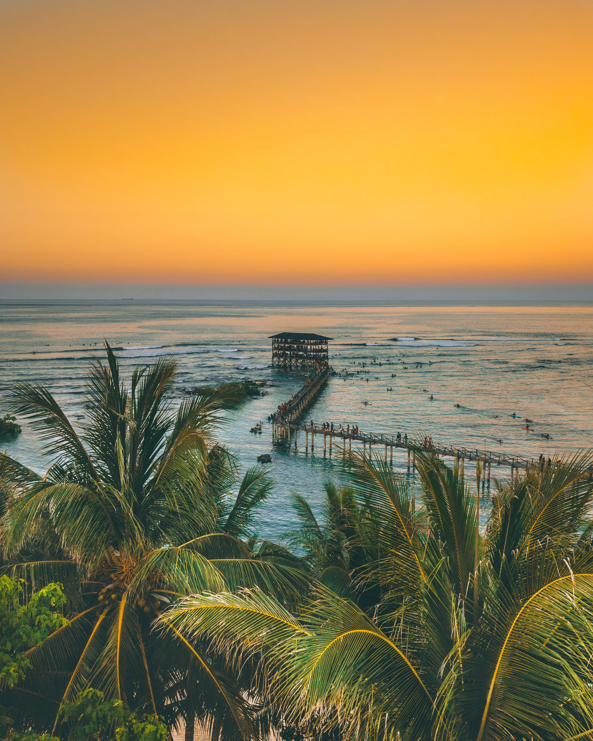 Free download wallpaper Sunset, Building, Nature, Palms, Pier, Ocean on your PC desktop