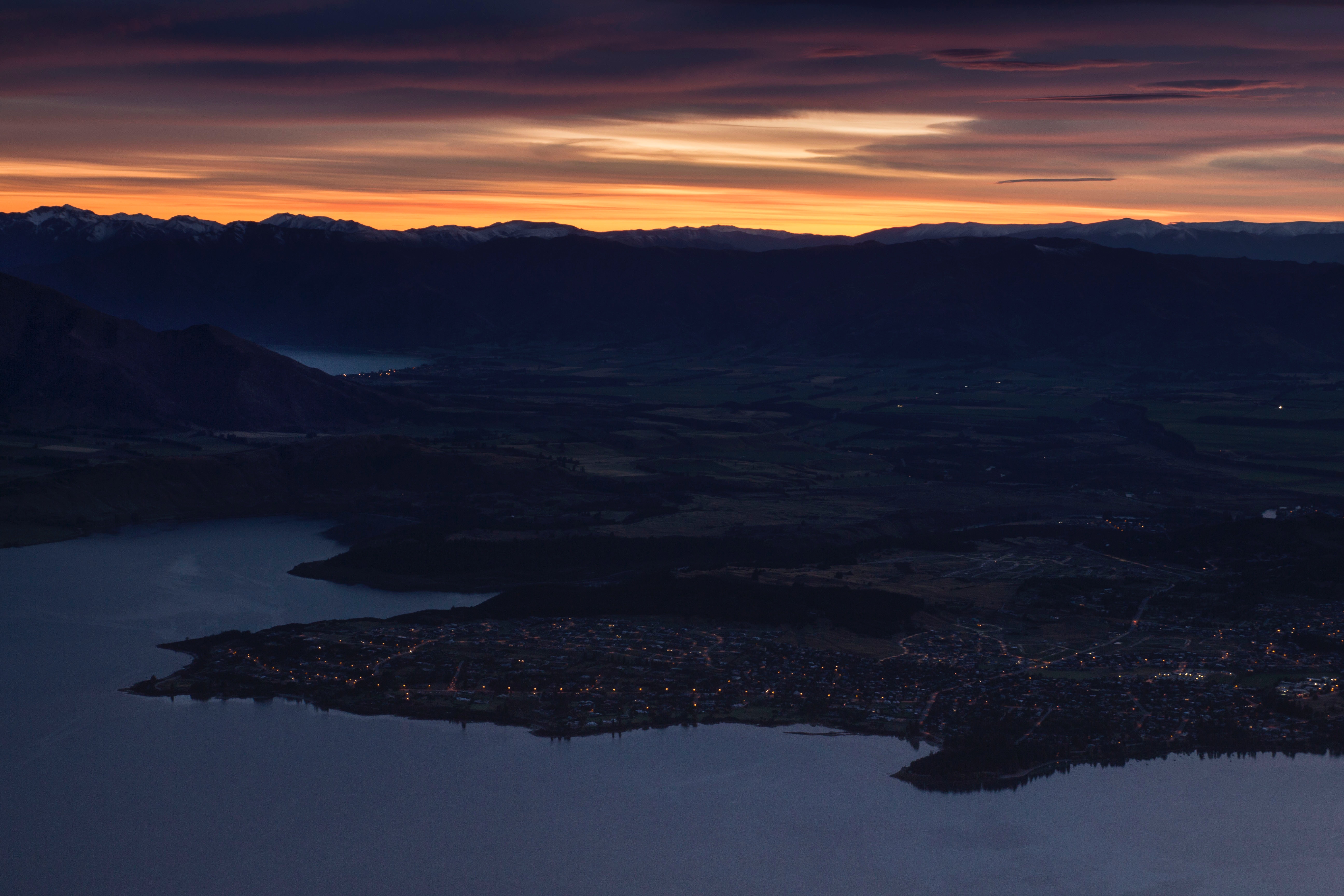 Free download wallpaper Nature, Sunset, Mountains, City, View From Above, New Zealand on your PC desktop