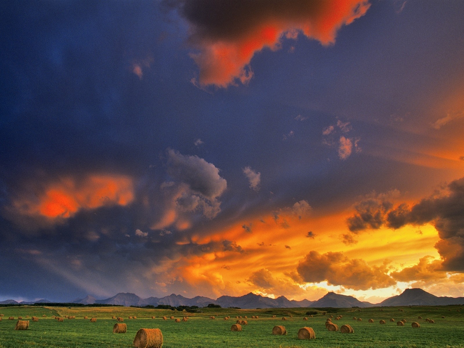 Free download wallpaper Sunset, Sky, Earth, Field, Haystack on your PC desktop