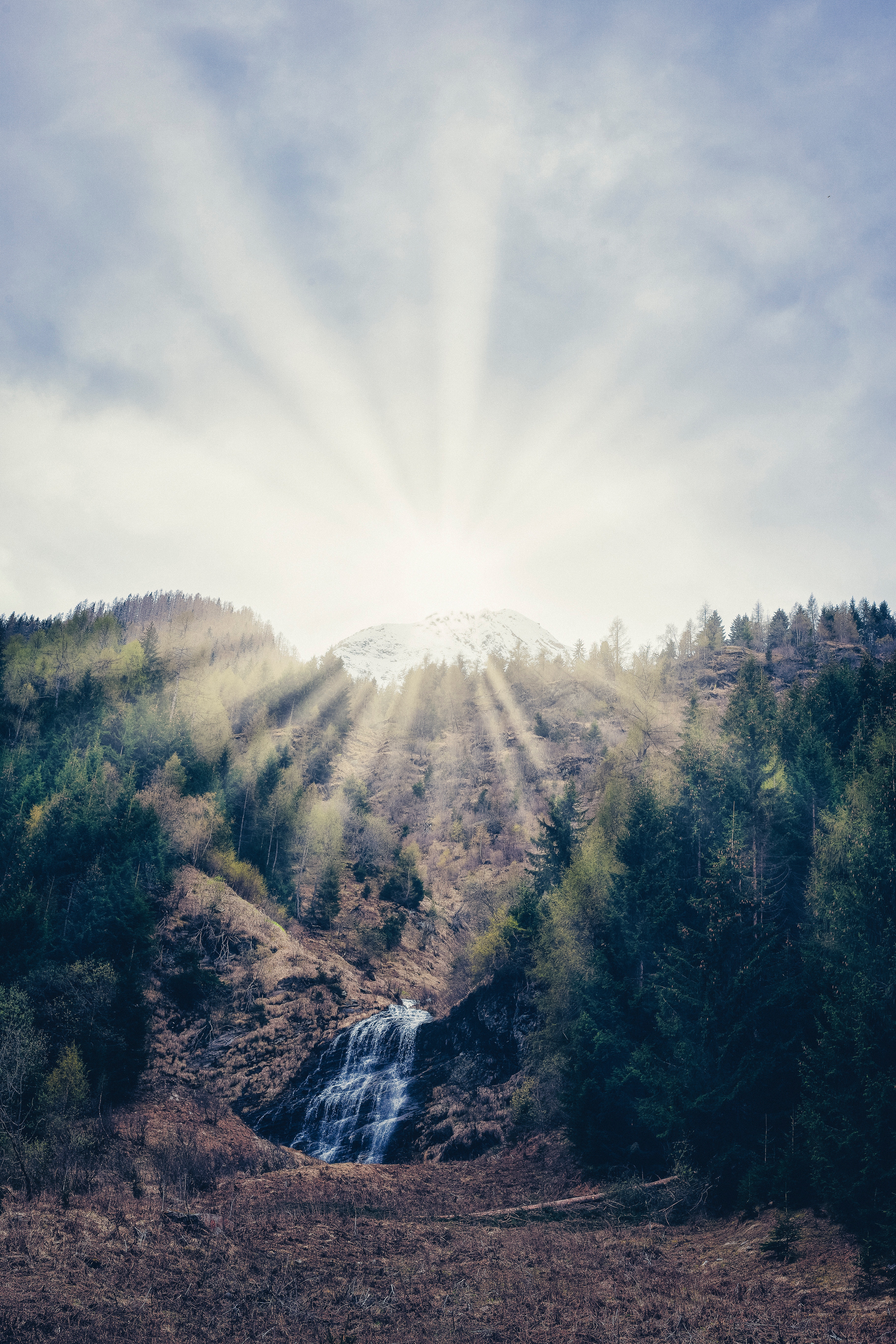 Free download wallpaper Slope, Rays, Mountain, Beams, Bright, Nature, Waterfall, Forest on your PC desktop