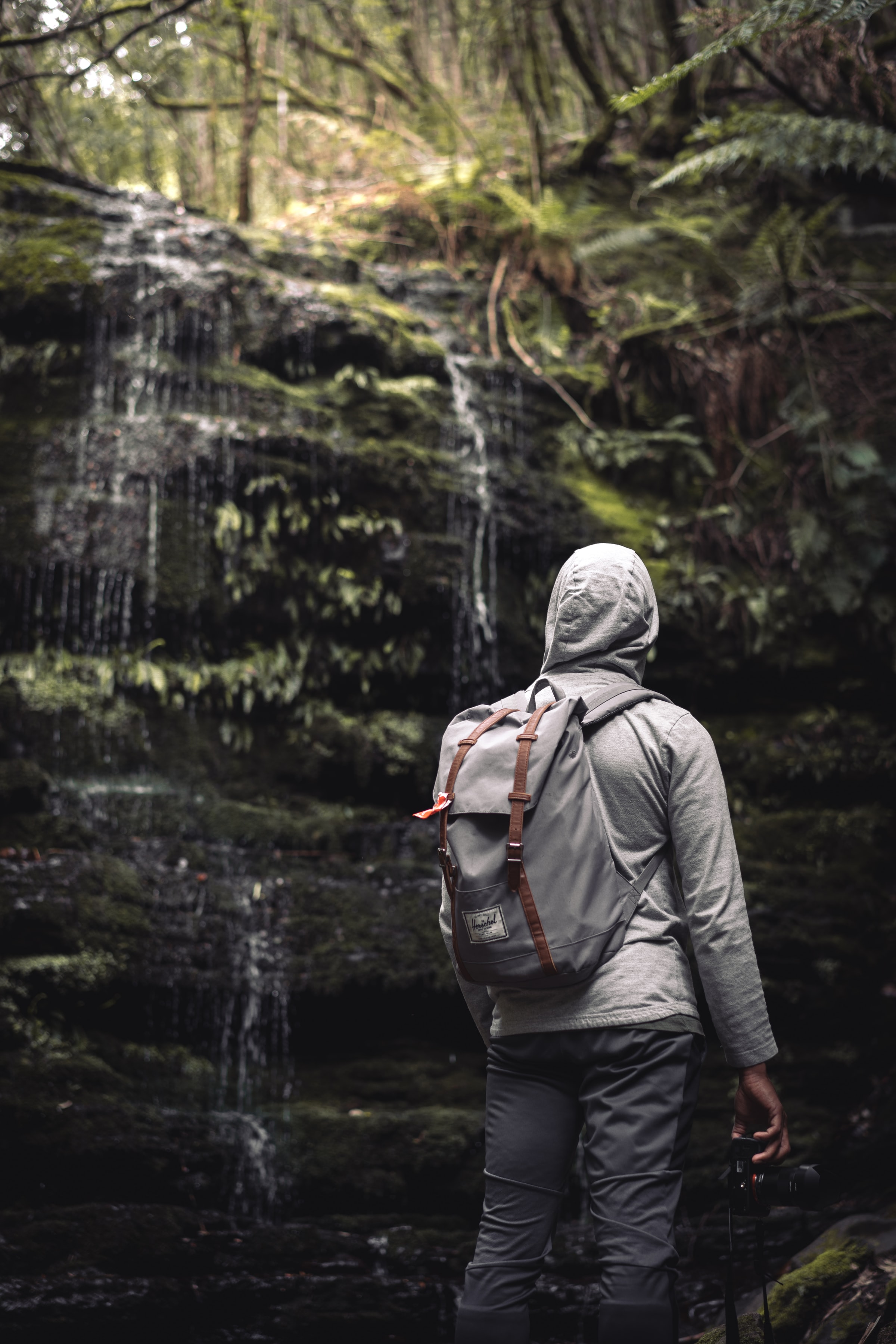 Free download wallpaper Miscellaneous, Waterfall, Person, Backpack, Rucksack, Miscellanea, Human, Hood on your PC desktop