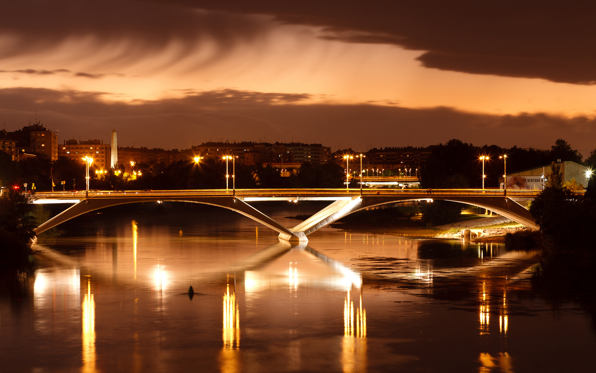 Download mobile wallpaper River, Bridge, Bridges, Light, Man Made, Night, City for free.
