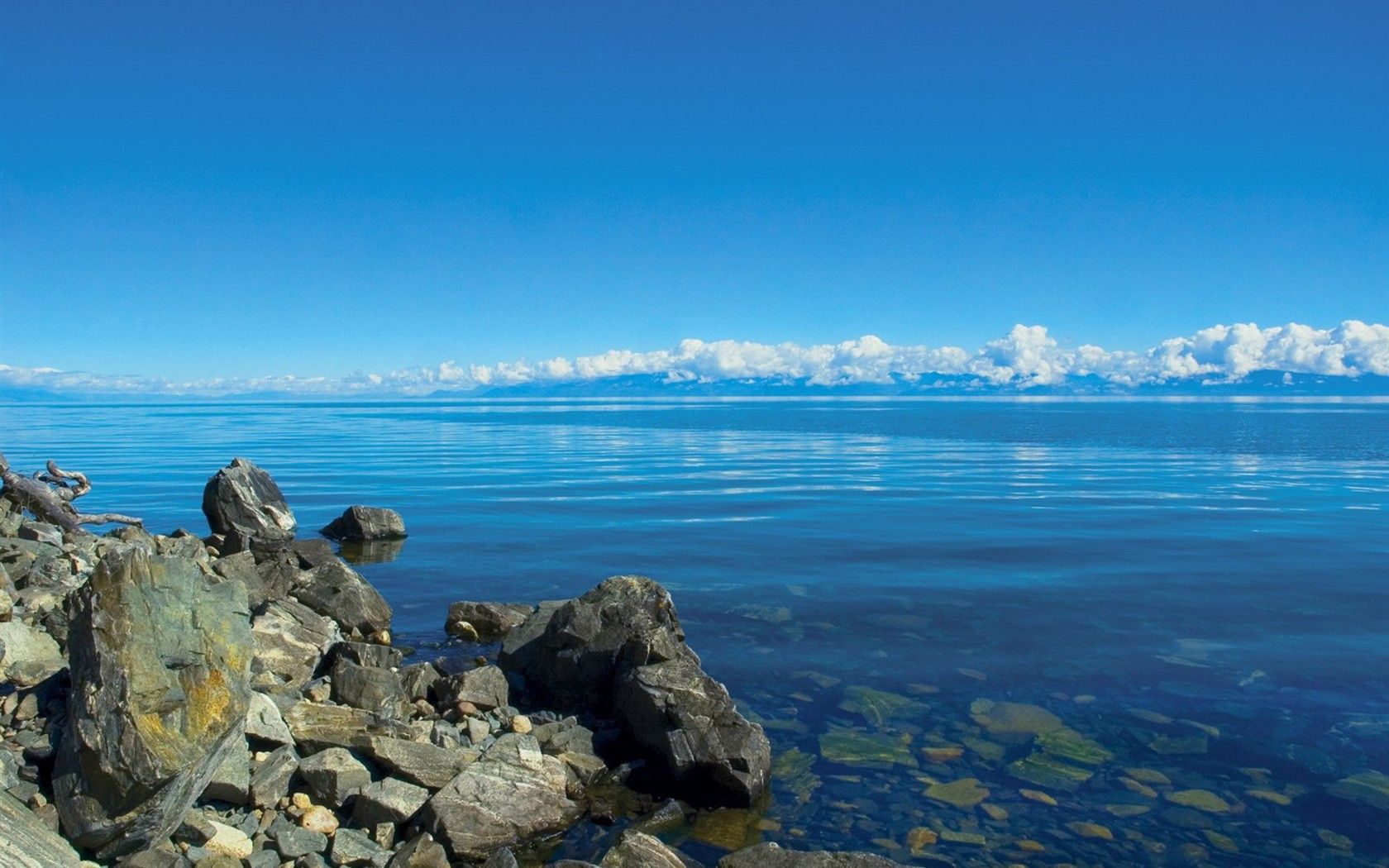 Baixe gratuitamente a imagem Água, Pedras, Nuvens, Lago, Transparente, Sibéria, Baikal, Natureza na área de trabalho do seu PC