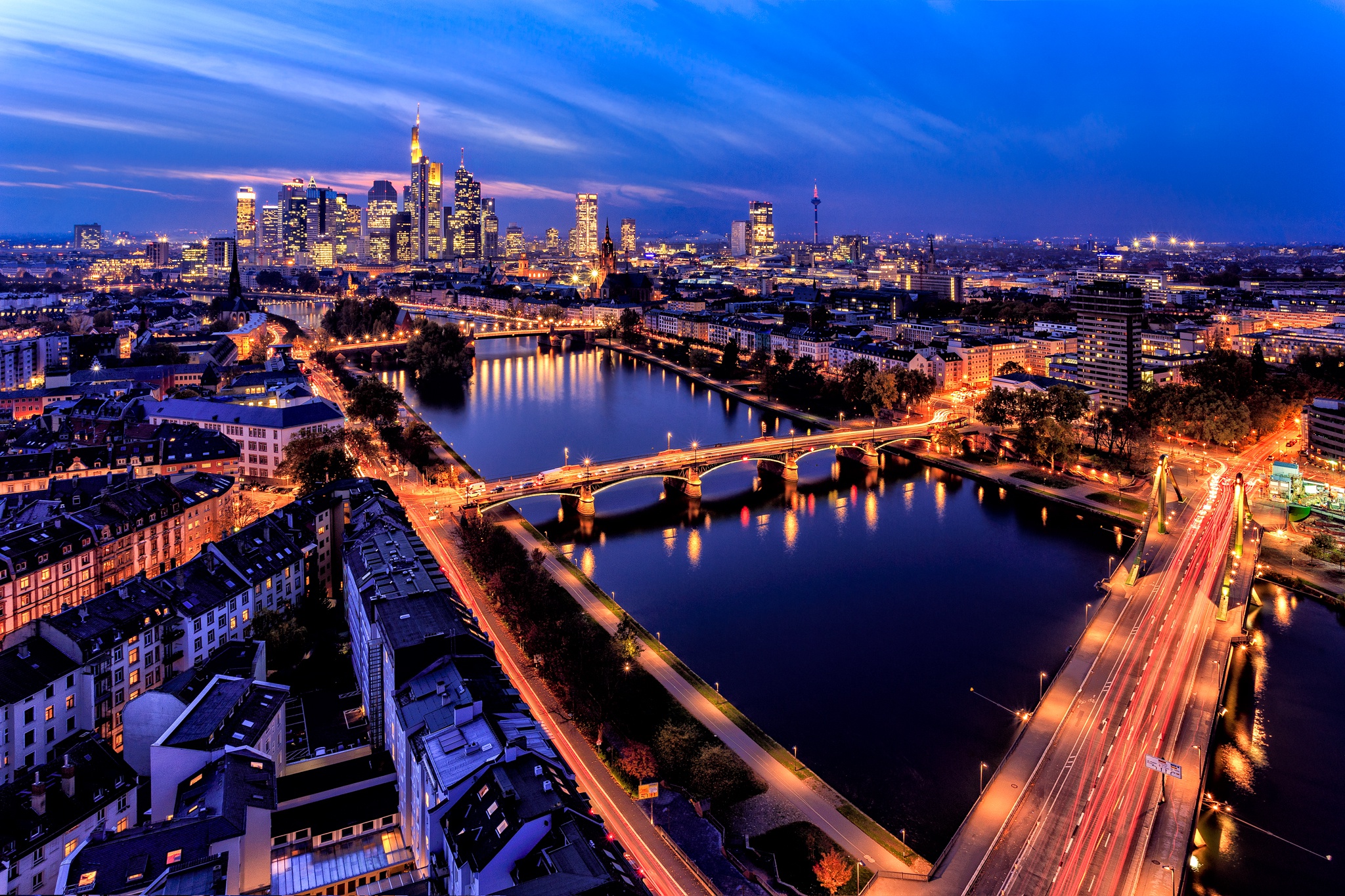 Download mobile wallpaper Cities, Night, Skyscraper, Building, Light, Cityscape, River, Germany, Town, Frankfurt, Man Made for free.