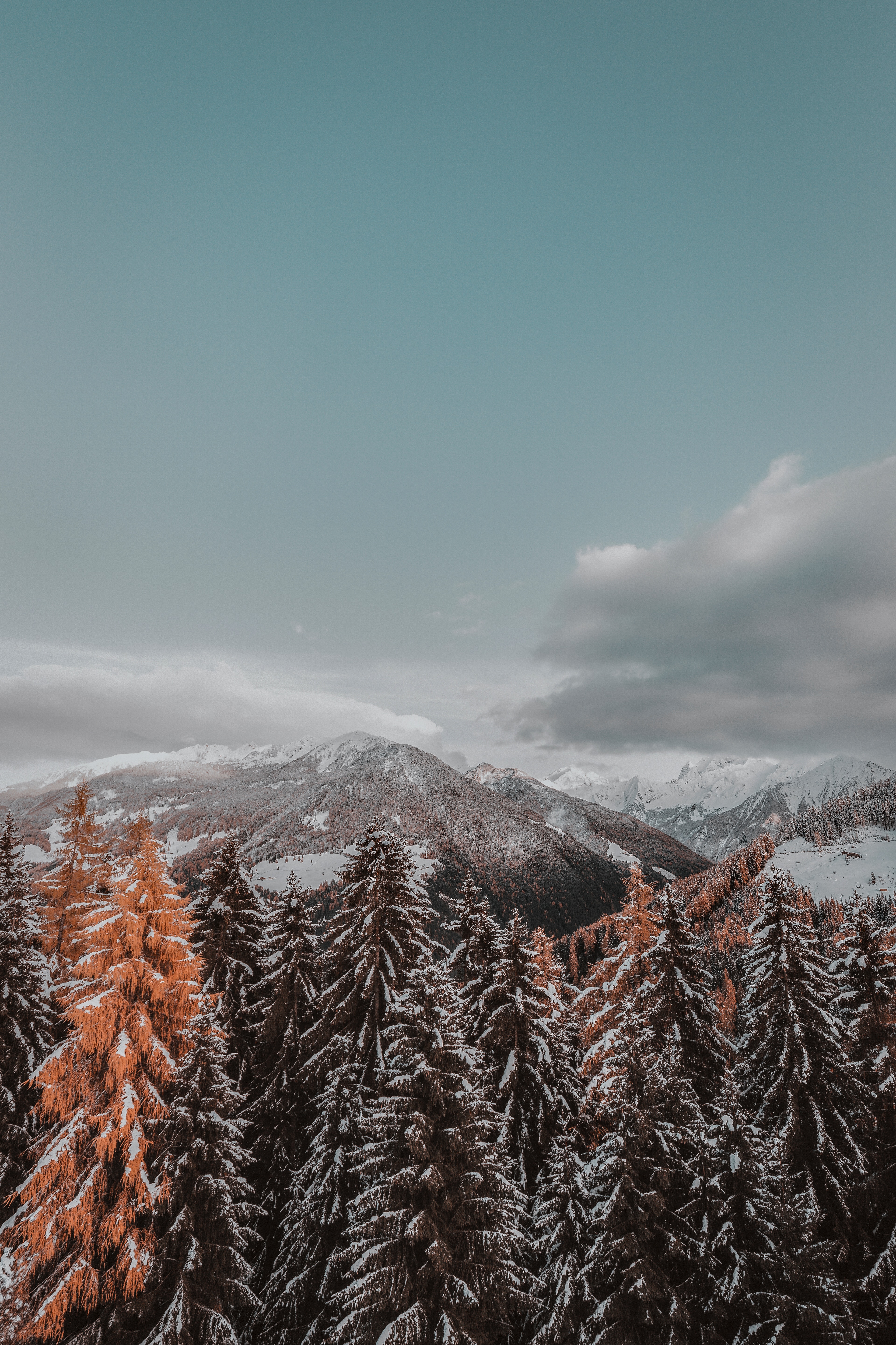 Download mobile wallpaper Snowbound, Clouds, Snow Covered, Mountains, Trees, Landscape, Nature for free.
