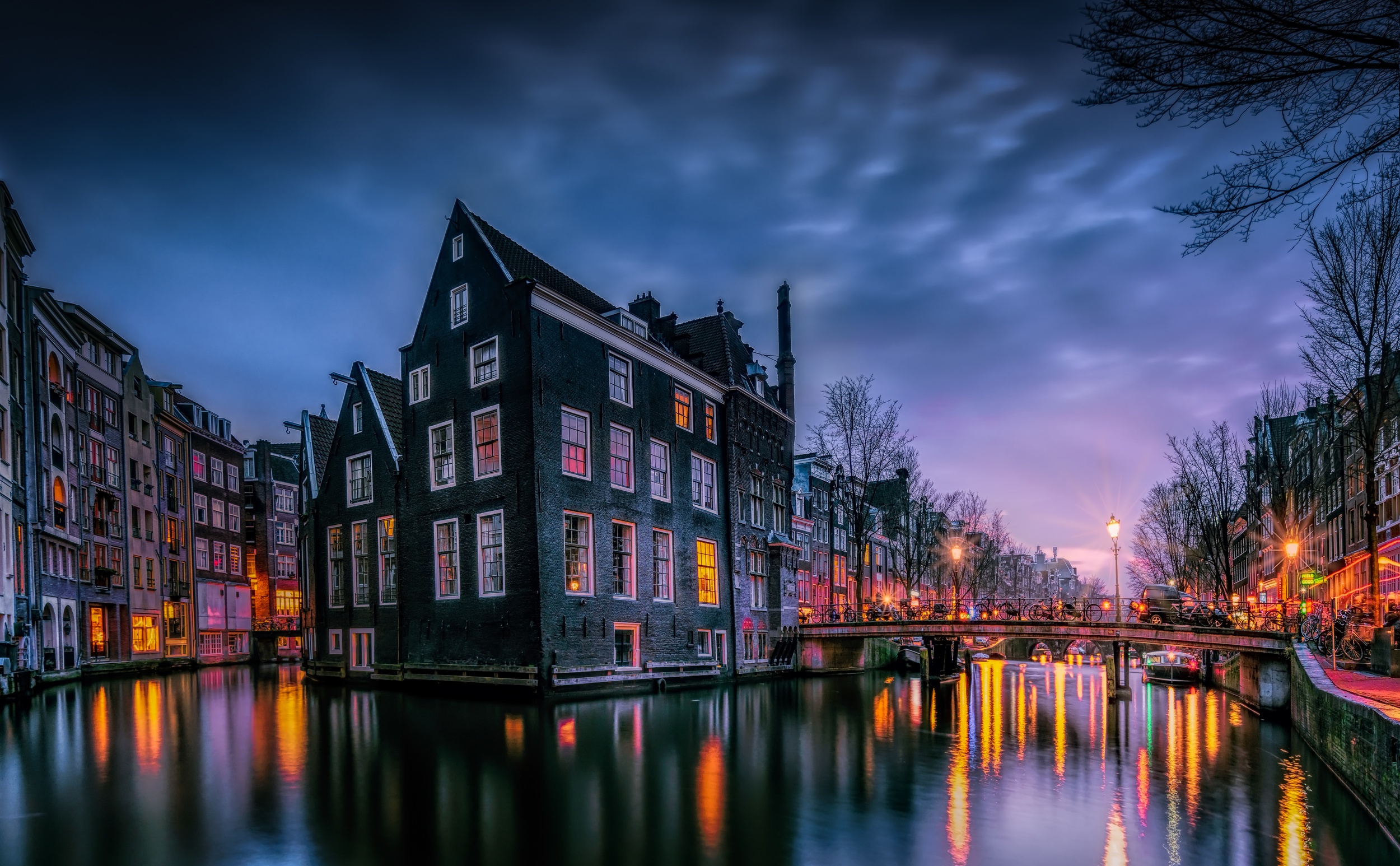 Download mobile wallpaper Cities, Night, City, Light, Netherlands, Amsterdam, Man Made, Canal for free.