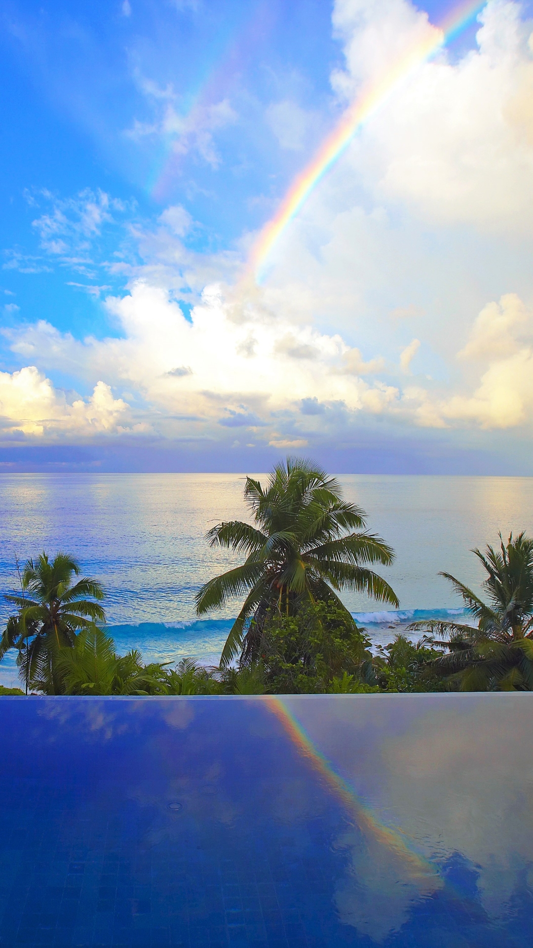 Download mobile wallpaper Sky, Sea, Rainbow, Horizon, Ocean, Earth, Tropical, Cloud, Palm Tree for free.