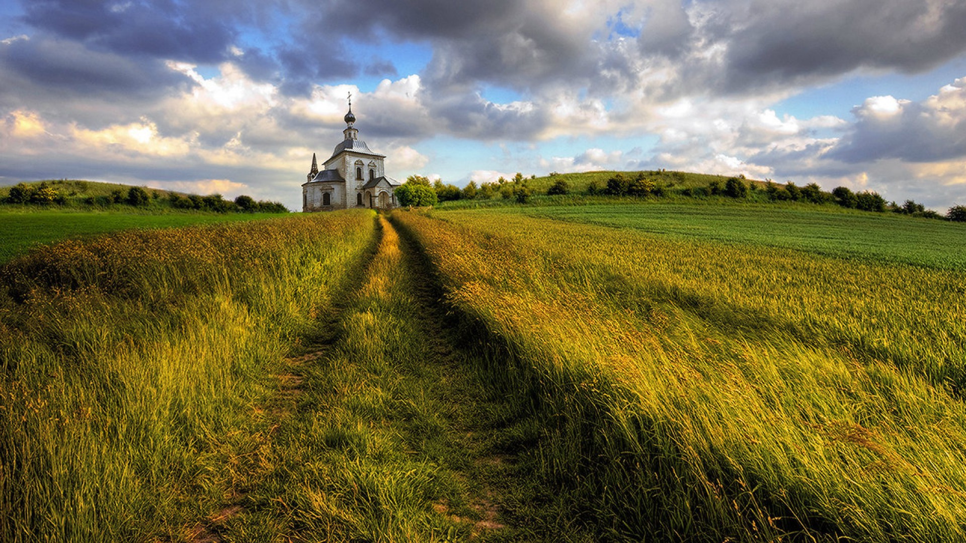 Download mobile wallpaper Churches, Church, Religious, Field, Grass, Cloud for free.
