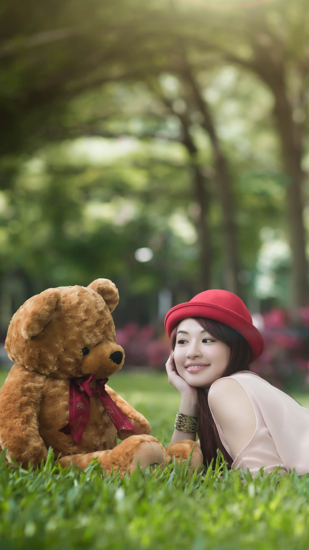 Download mobile wallpaper Grass, Teddy Bear, Smile, Mood, Hat, Oriental, Model, Women, Asian for free.
