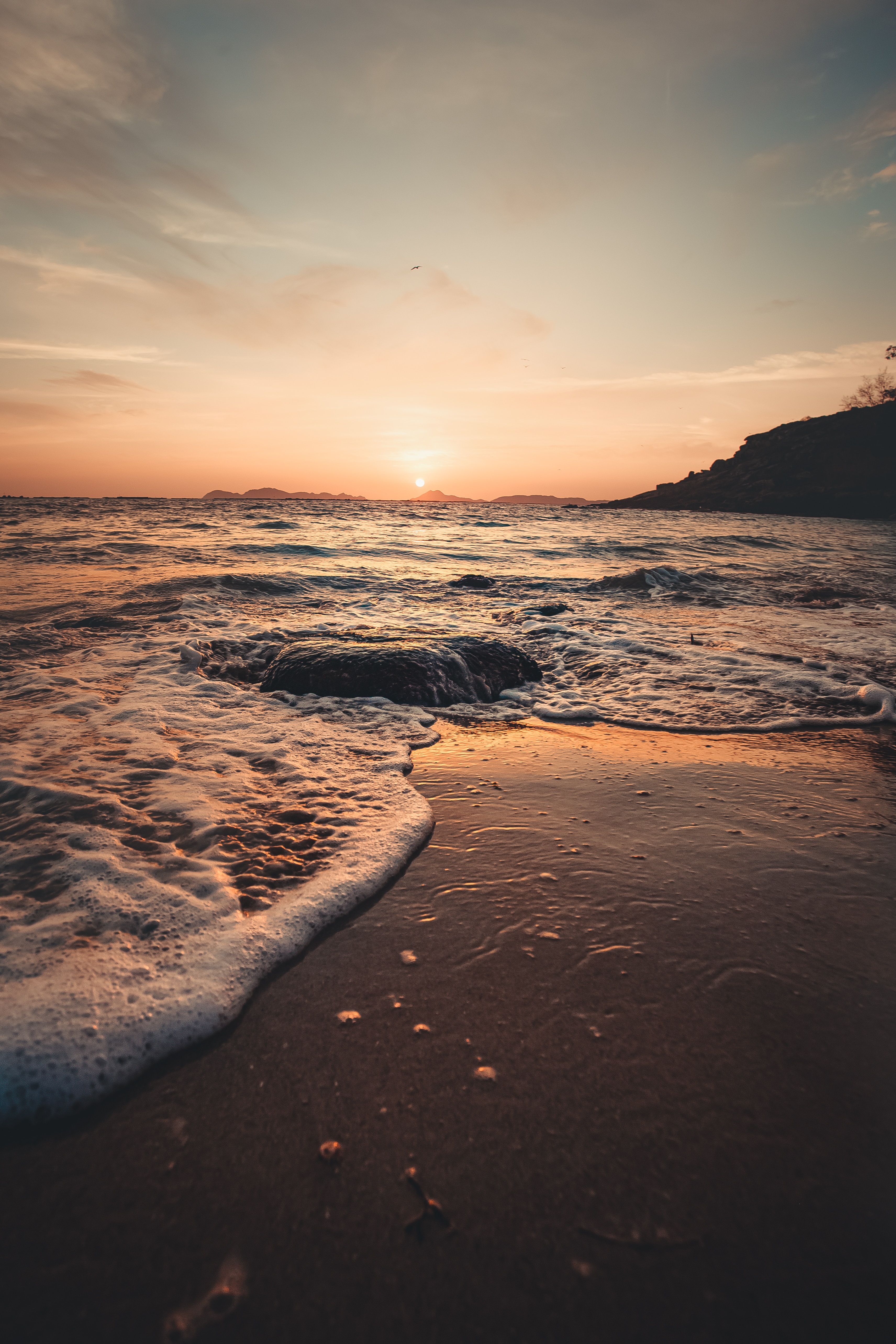 Free download wallpaper Nature, Sunset, Rocks, Sea, Waves, Beach on your PC desktop
