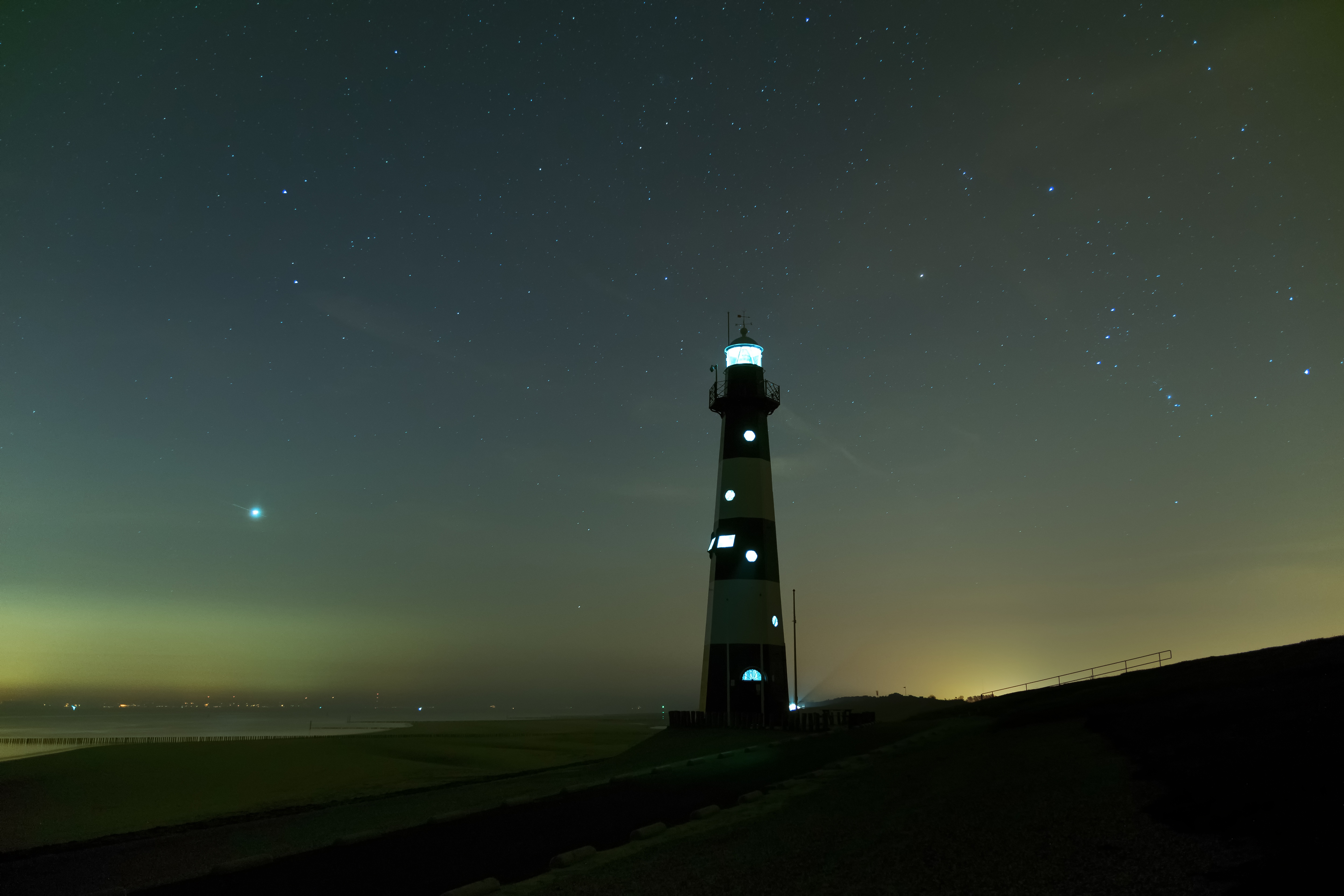 Download mobile wallpaper Fog, Nature, Lighthouse, Night, Starry Sky, Glow for free.