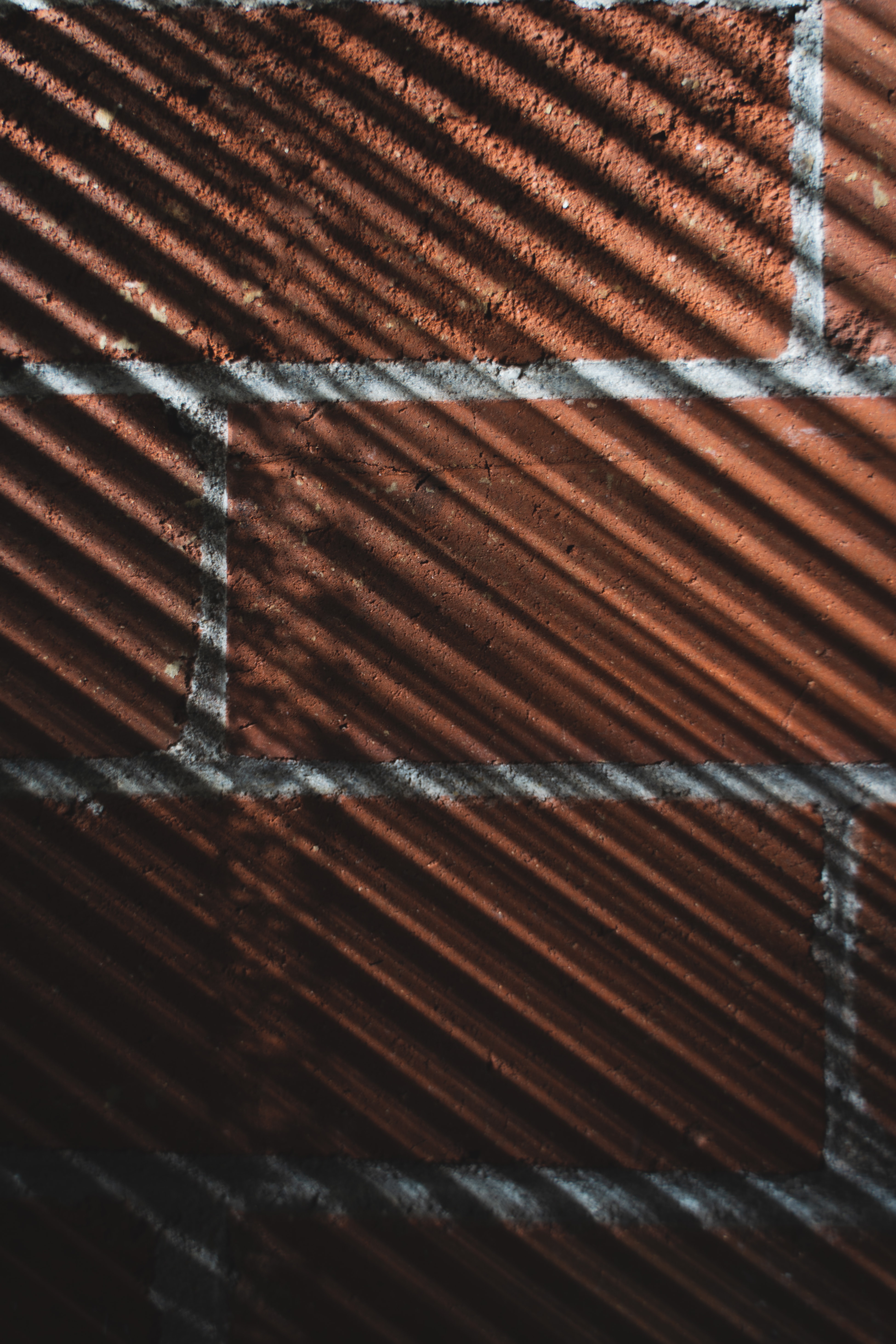 Download mobile wallpaper Shadow, Streaks, Wall, Stripes, Texture, Textures, Brick for free.