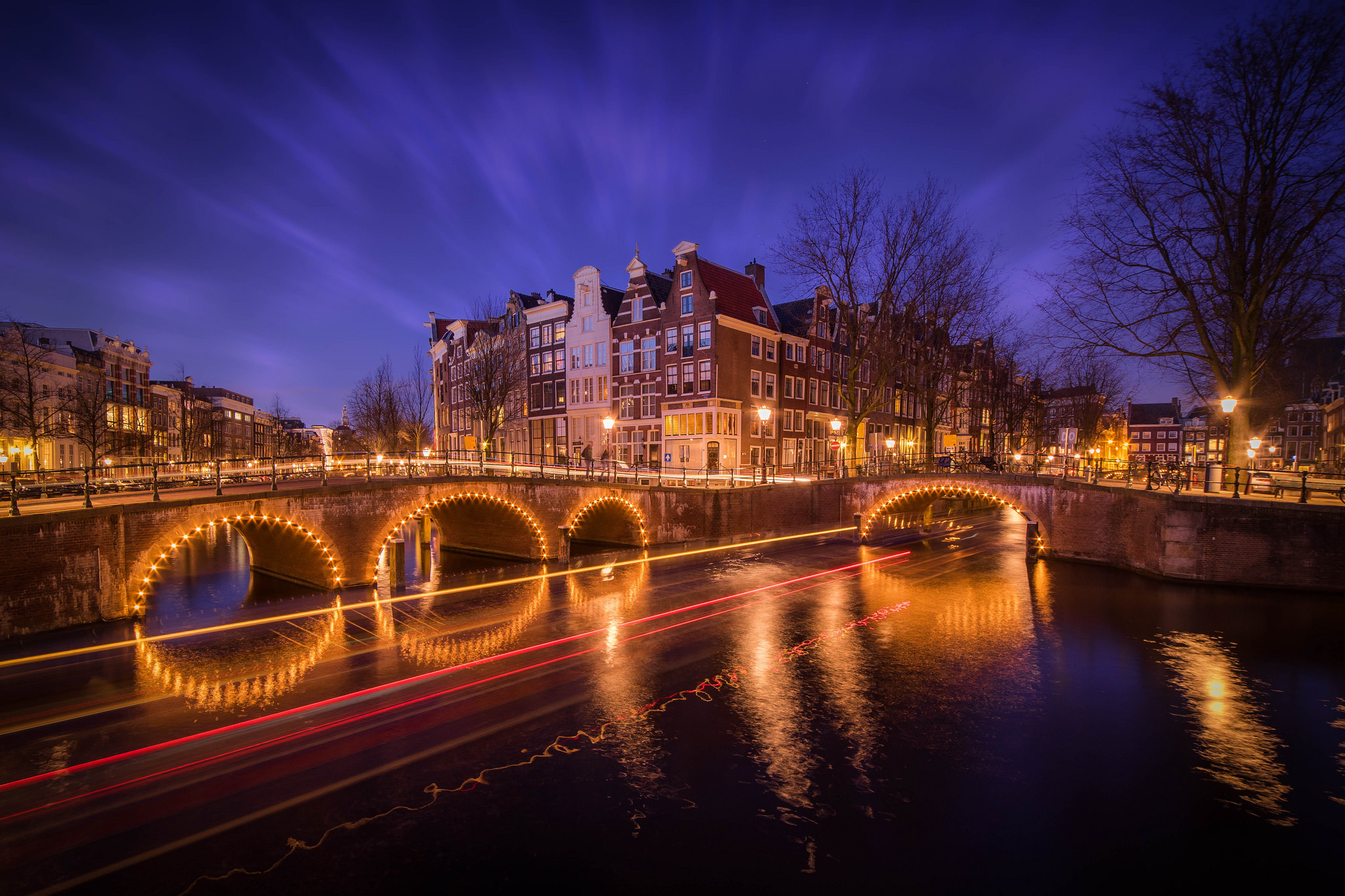 Free download wallpaper Cities, Night, City, Reflection, Light, Bridge, Netherlands, Amsterdam, Man Made, Time Lapse on your PC desktop