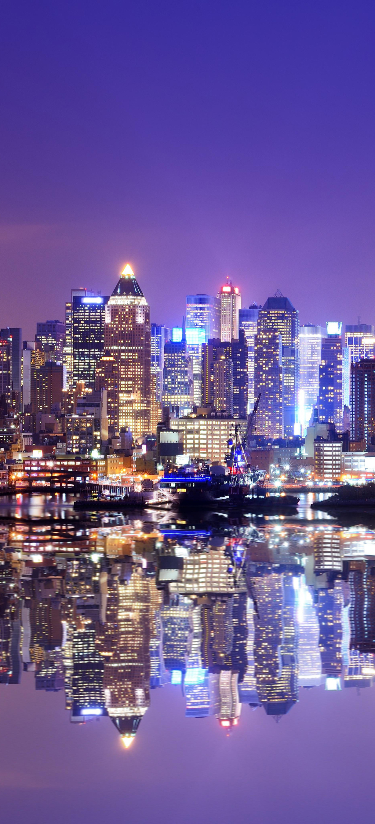 Download mobile wallpaper Cities, Night, Usa, City, Skyscraper, Building, Reflection, New York, Man Made for free.