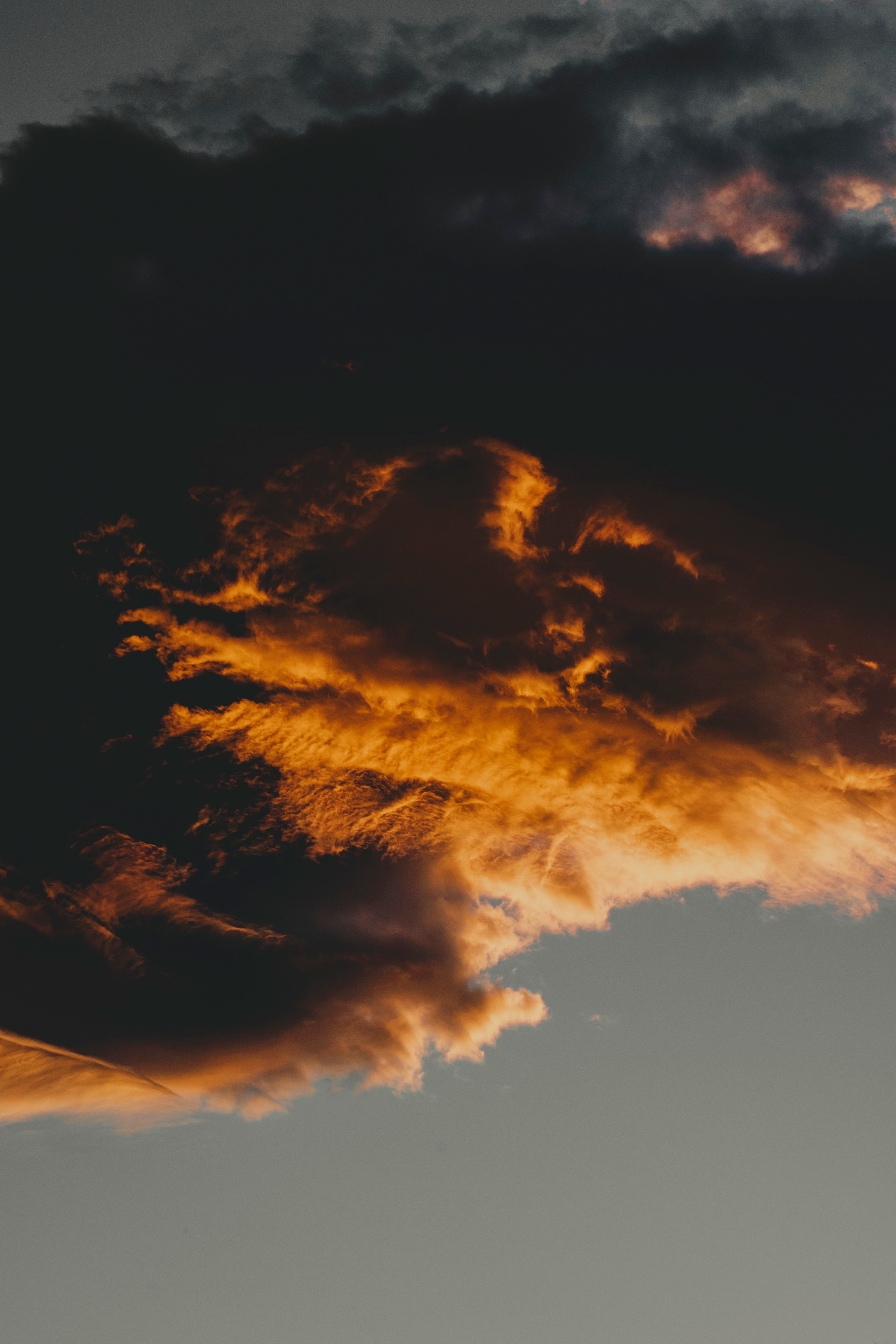 Download mobile wallpaper Porous, Clouds, Sunset, Sky, Nature, Dark for free.