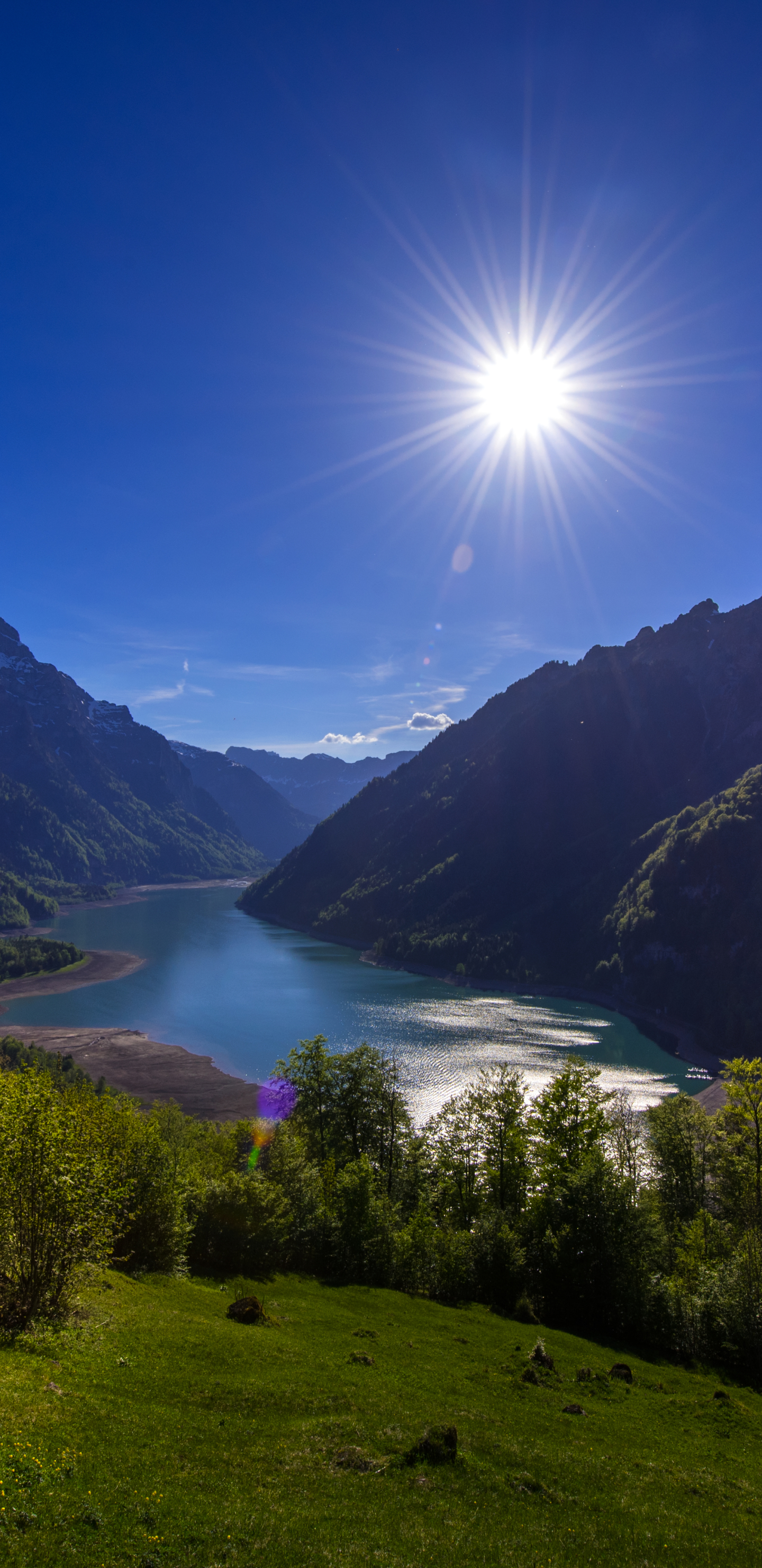 Скачати мобільні шпалери Пейзаж, Сонце, Гора, Озеро, Земля, Швейцарія безкоштовно.