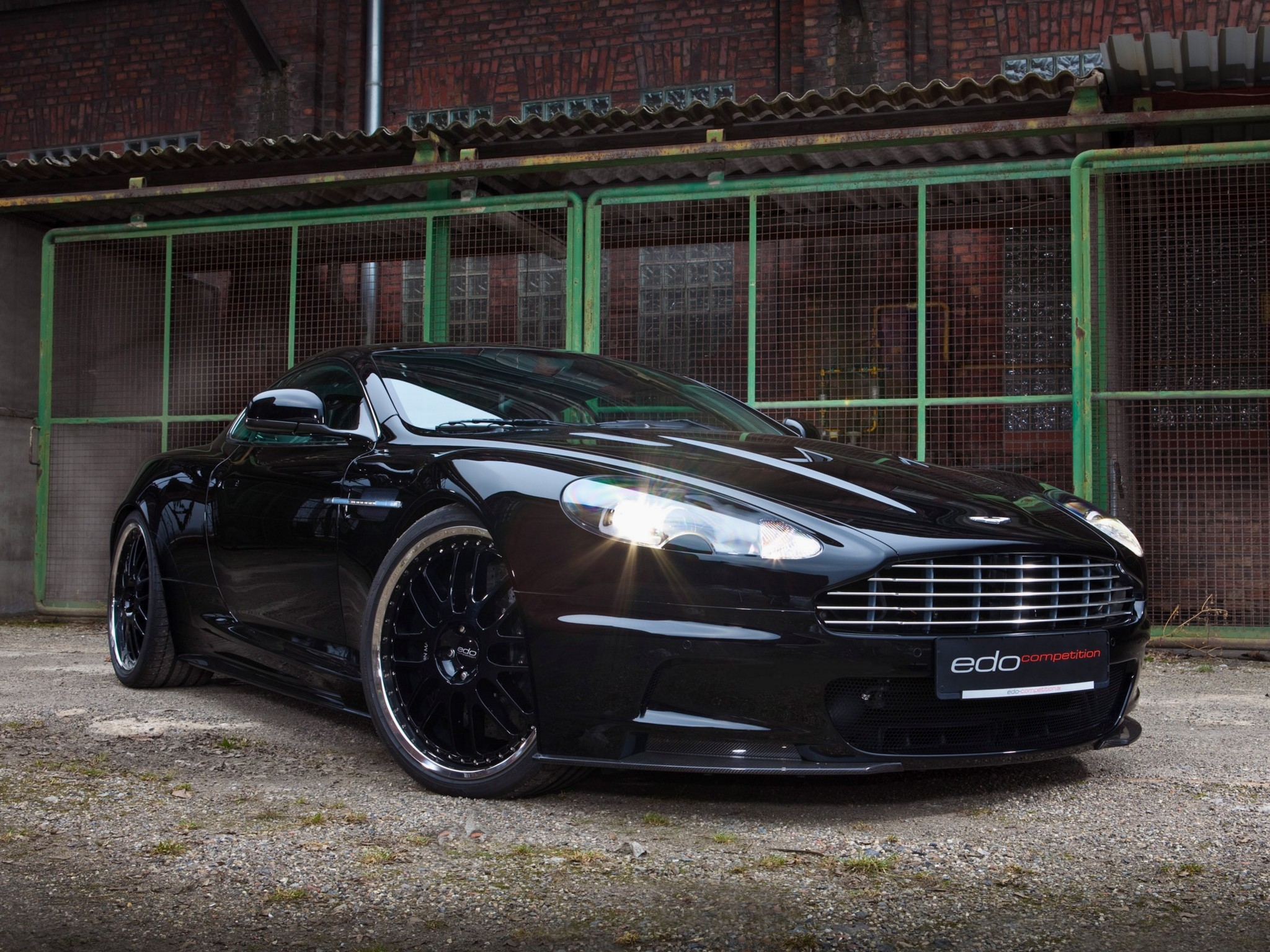 dbs, cars, sports, aston martin, black, building, front view, 2010 mobile wallpaper